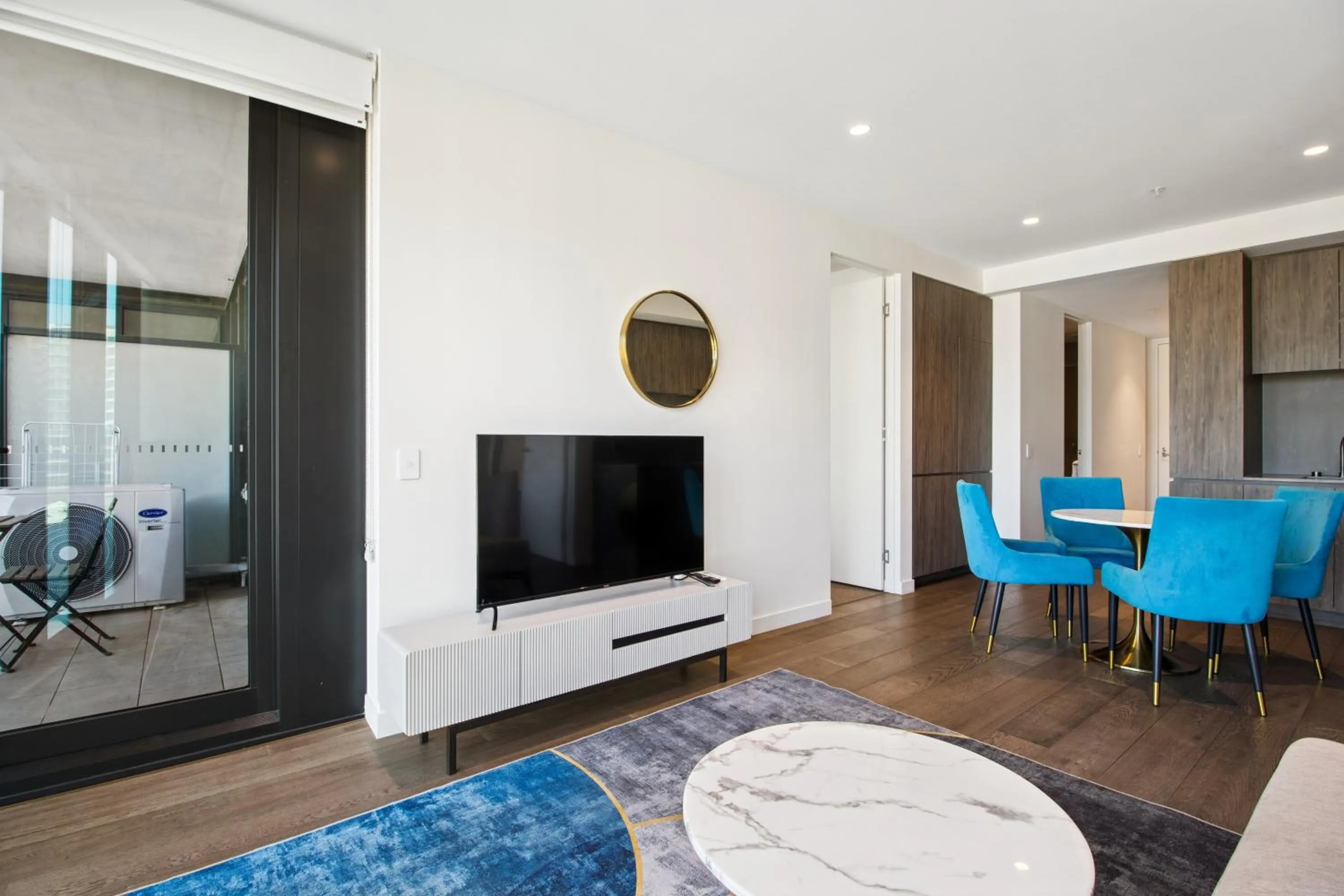 TV and multimedia in Realm Apartments by CLLIX