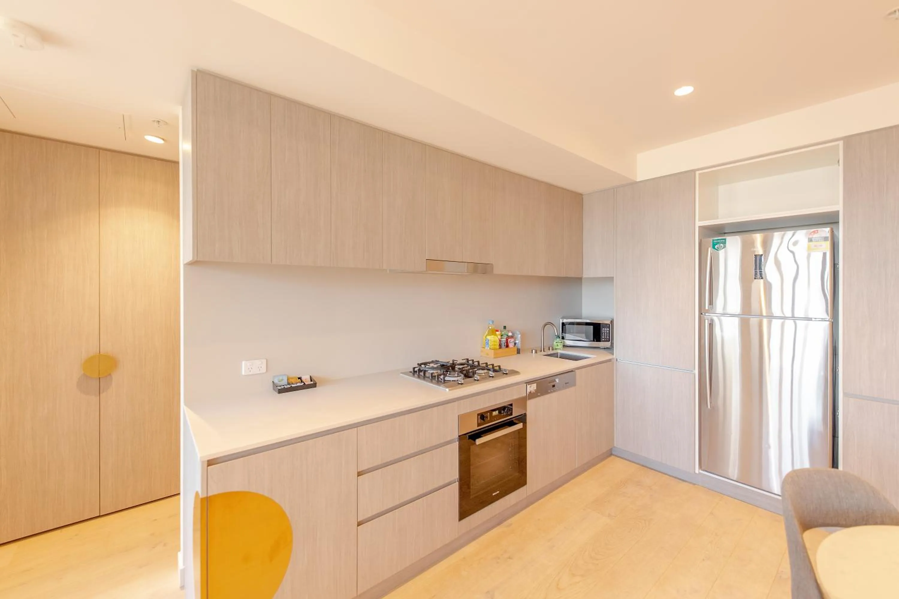 Kitchen or kitchenette in Realm Apartments by CLLIX