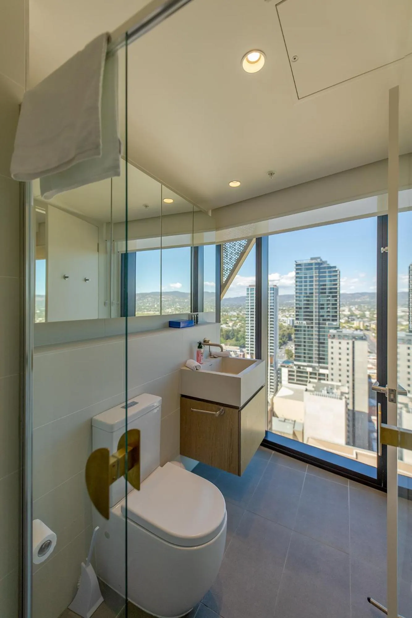 Toilet in Realm Apartments by CLLIX