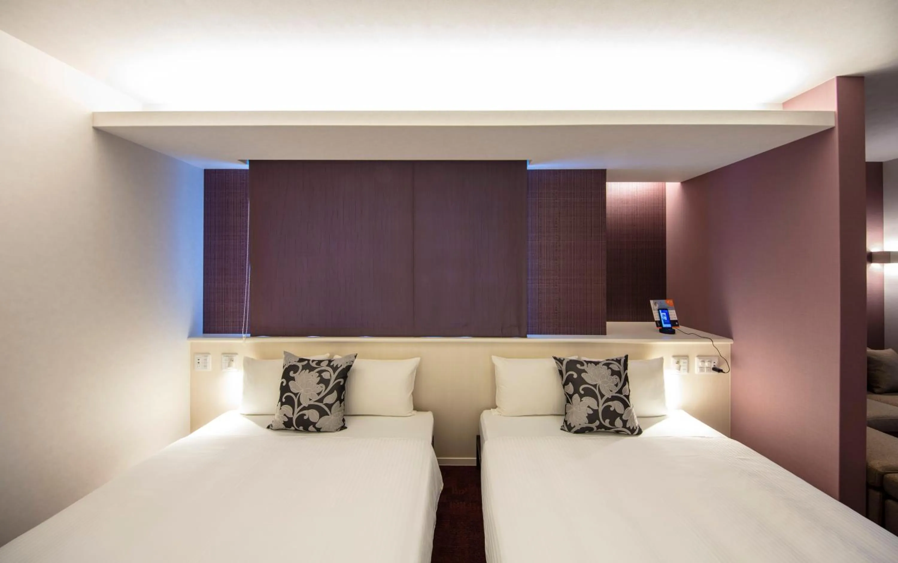 Bed in GRAND BASE Okayama Ekimae