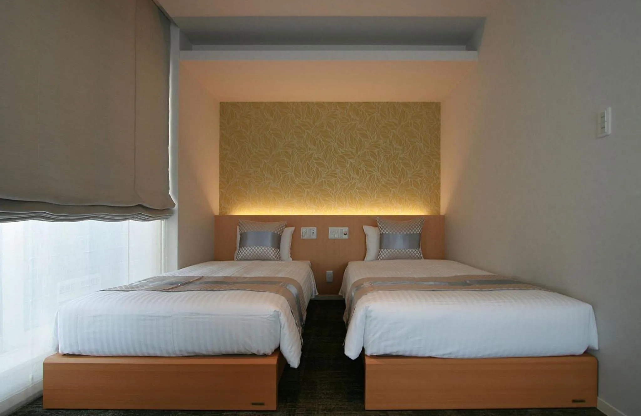 Bed in GRAND BASE Okayama Ekimae