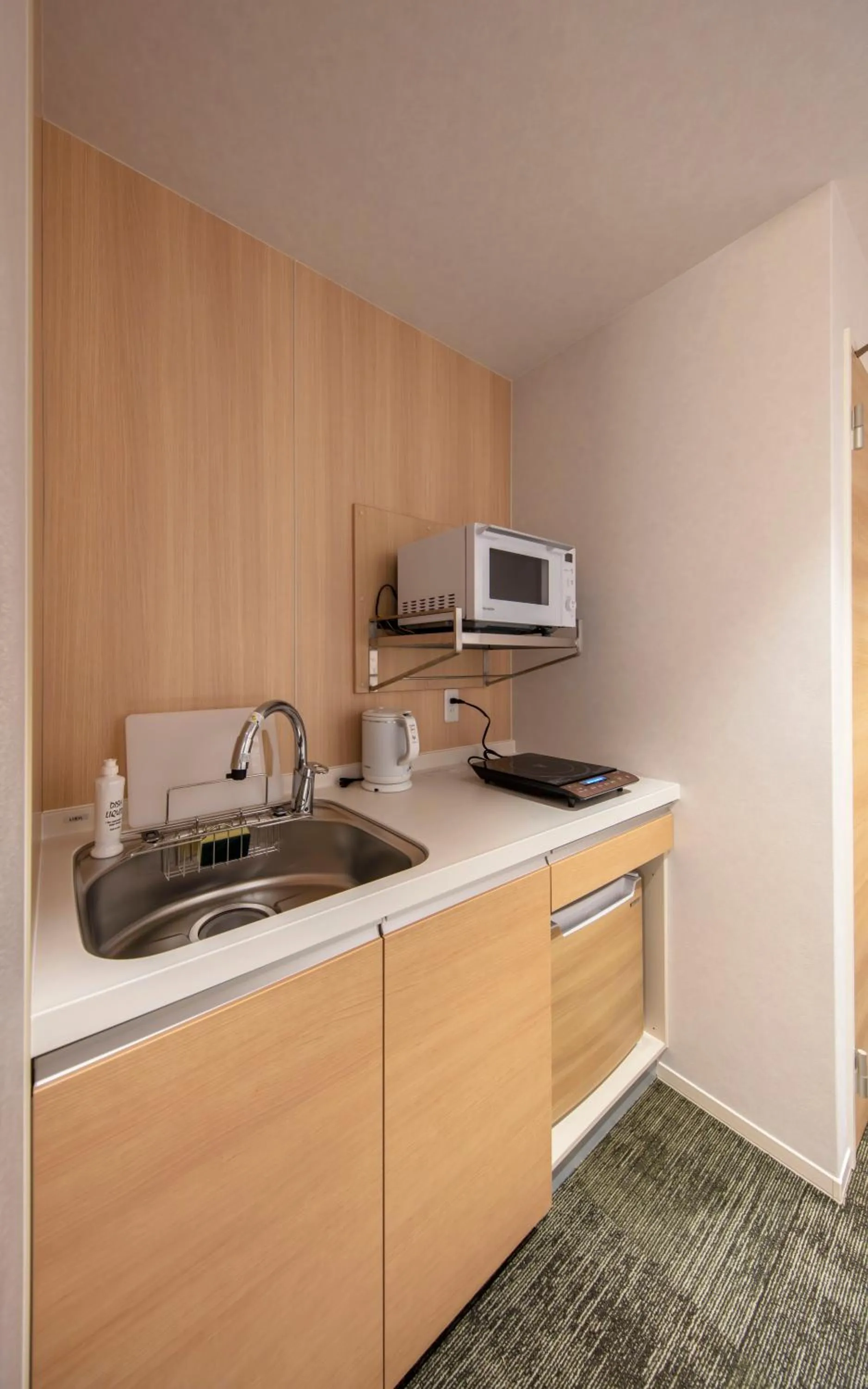 Kitchen or kitchenette in GRAND BASE Okayama Ekimae