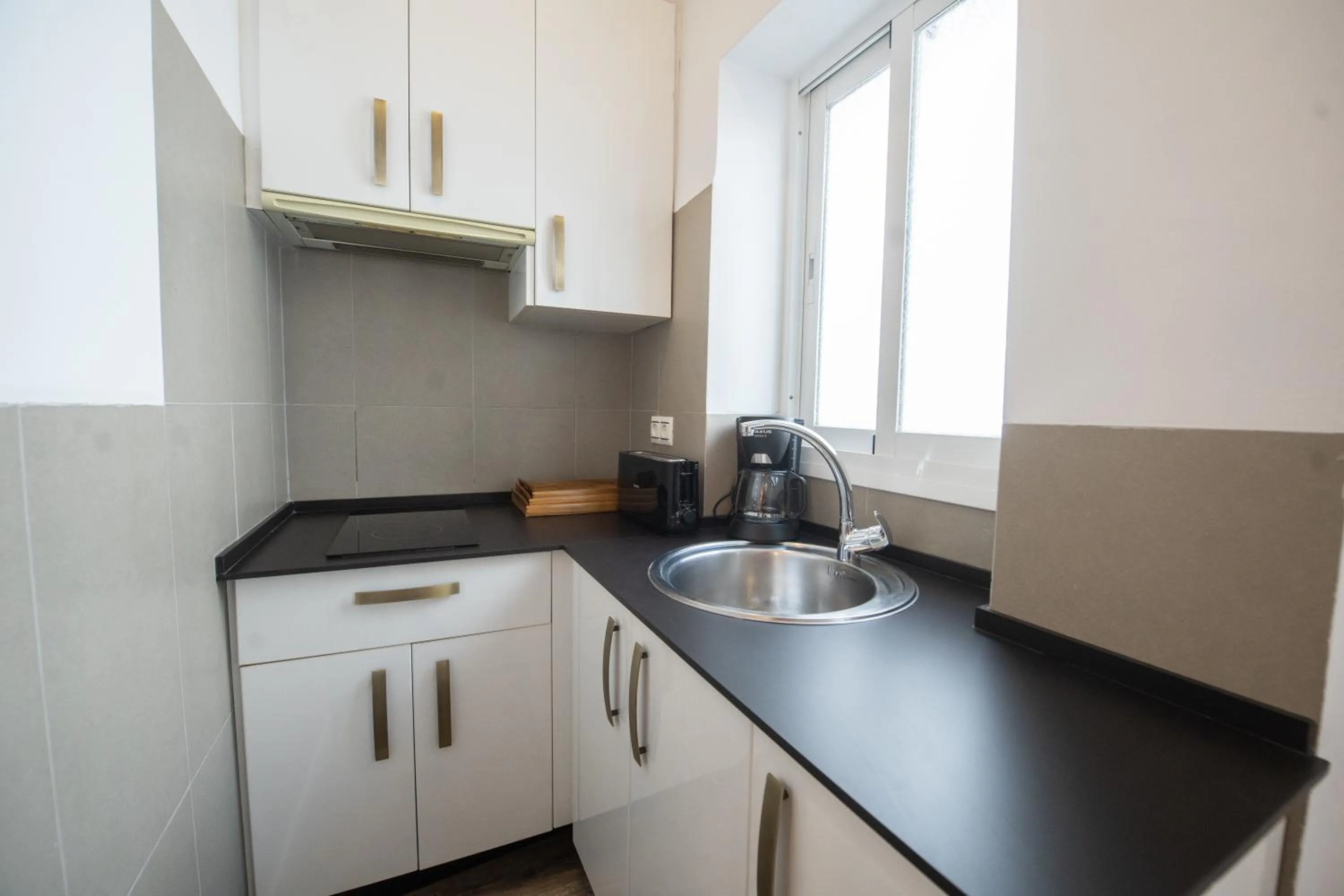 Kitchen or kitchenette in Suites La Merced