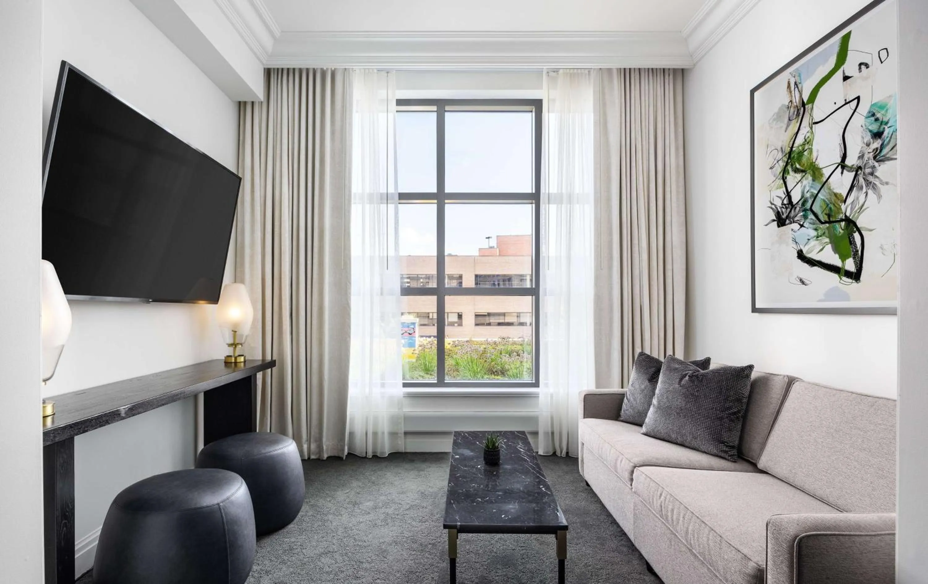 Living room in Daxton Hotel Birmingham, Curio Collection by Hilton