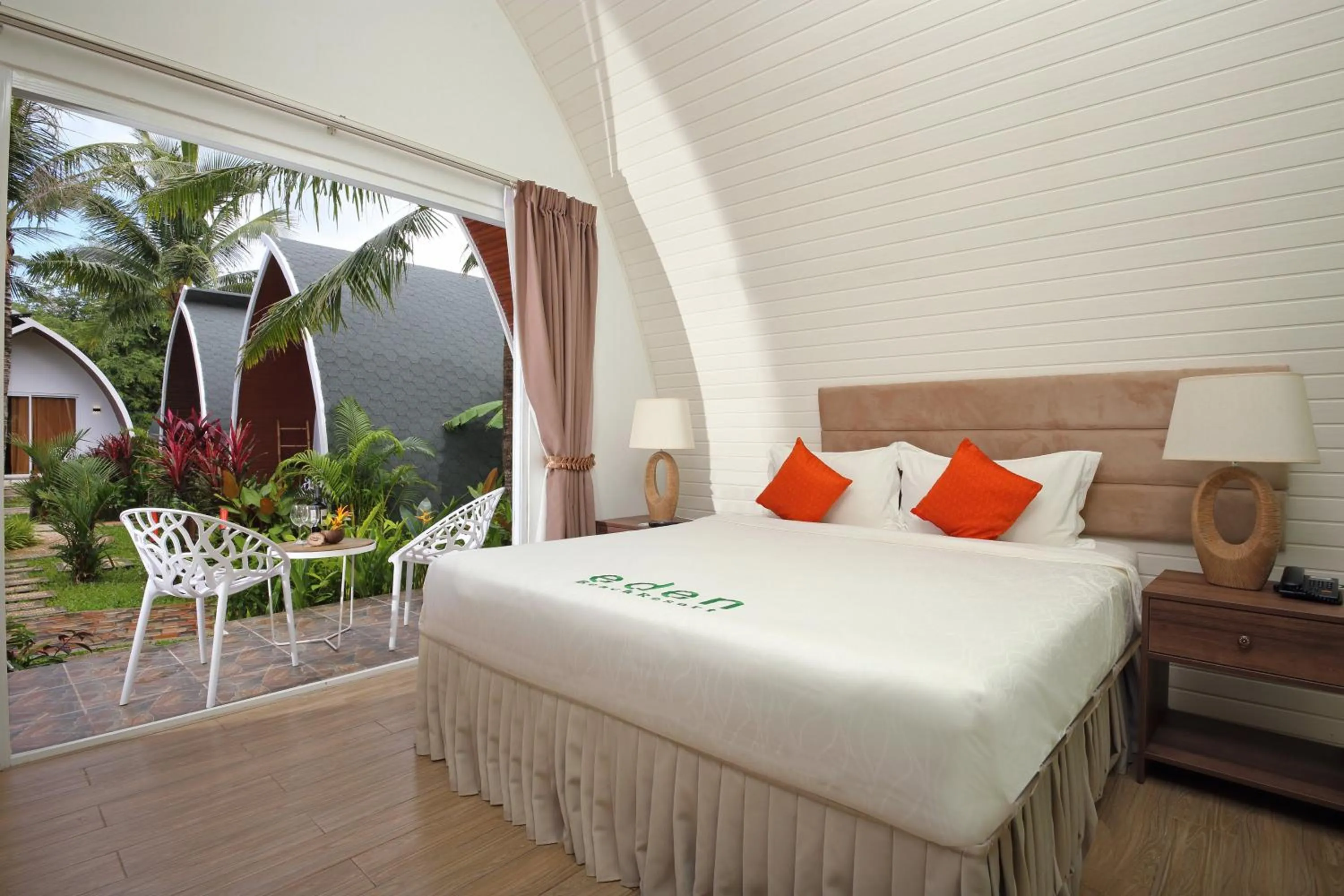 Patio, Bed in Eden Beach Resort by EHM