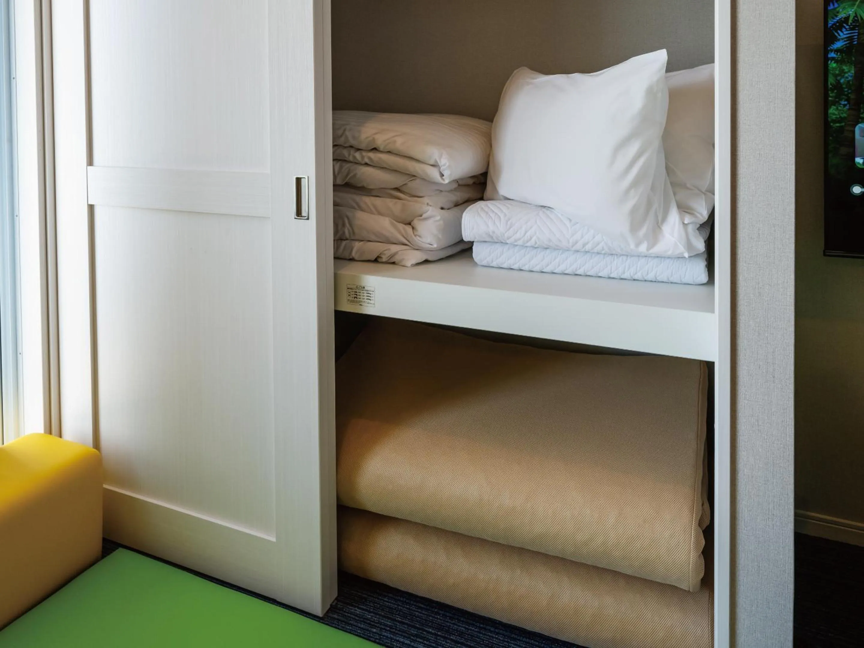 Photo of the whole room, Bed in Family Condo Chatan Hills by Coldio Premium