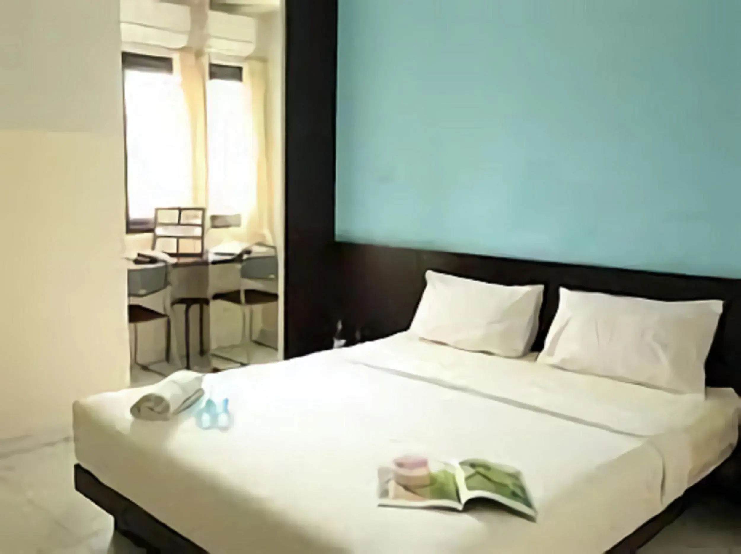 Bed in LeGreen Suite Ratulangi Bed in LeGreen Suite Ratulangi