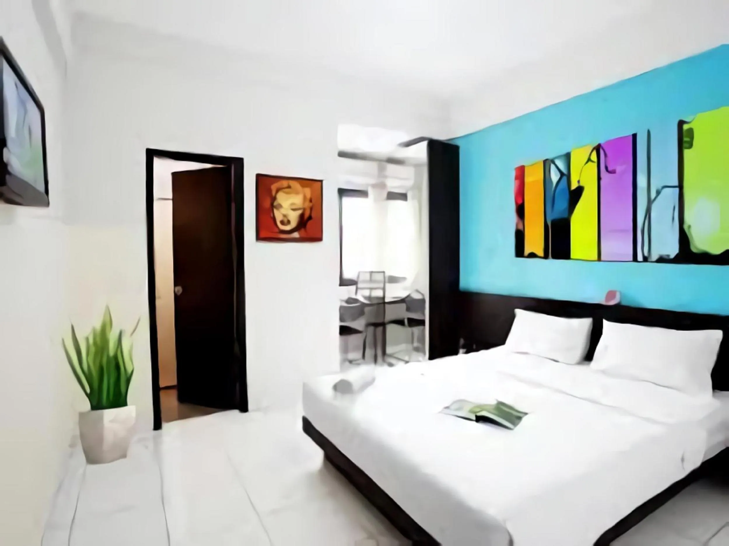 Bed in LeGreen Suite Ratulangi