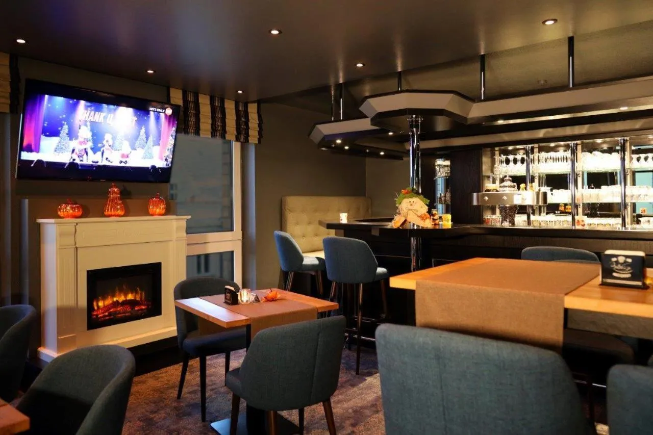 Communal lounge/ TV room in Hotel Märkischer Hof