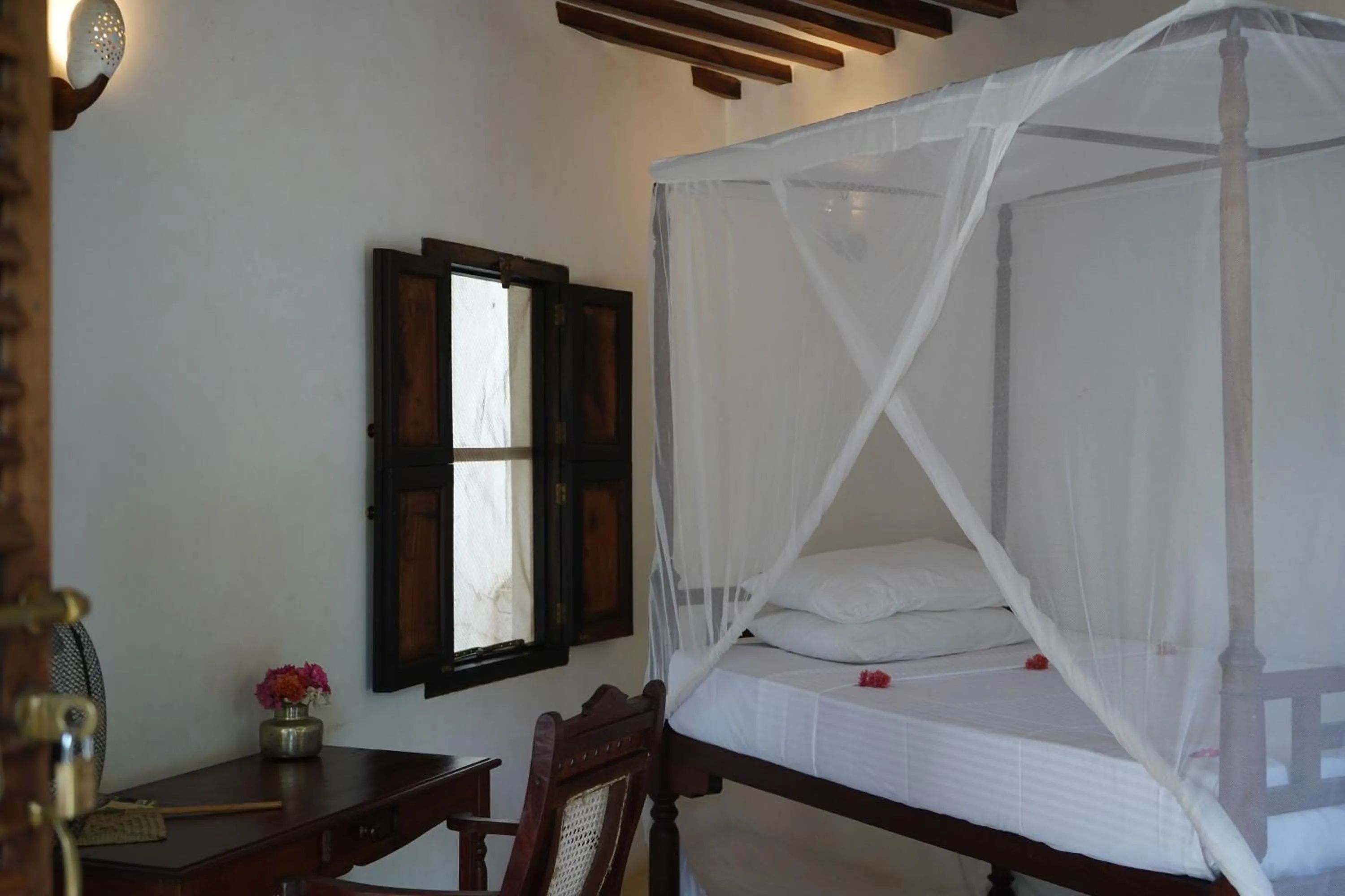 Bed in Kijani Hotel