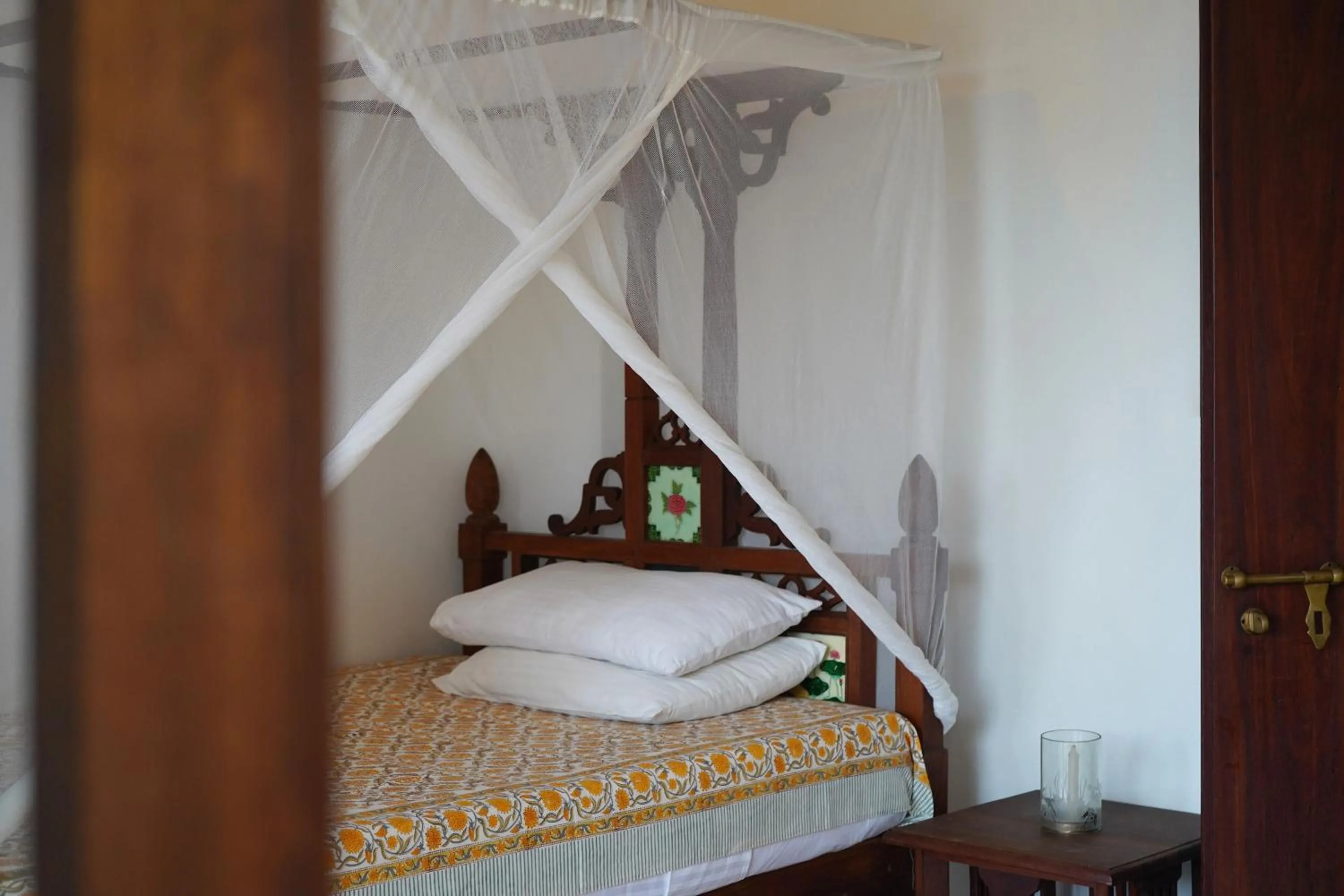 Bed in Kijani Hotel