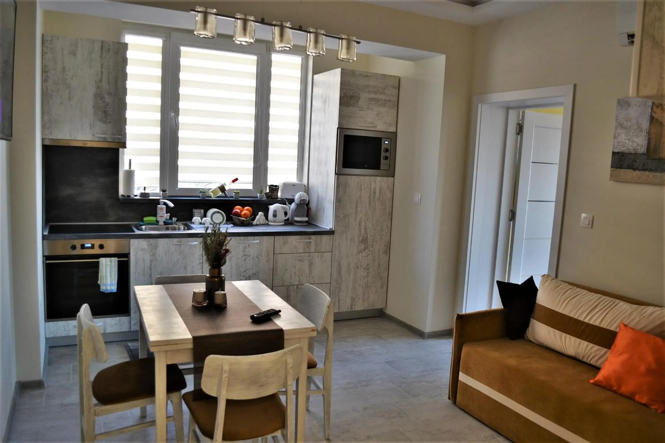 Communal lounge/ TV room in Guest Apartment Balkan