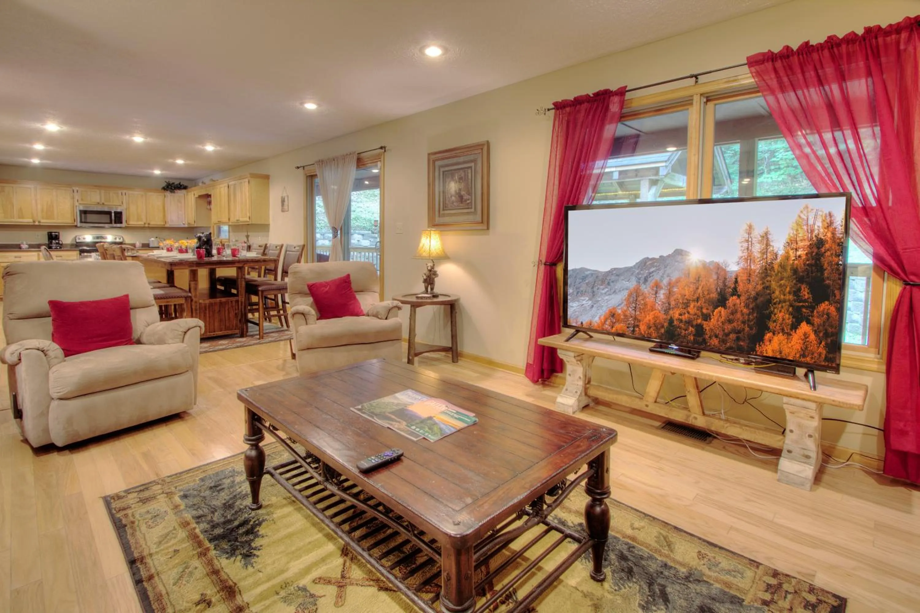 Living room in Gorgeous "Country Roads" by HoneyBearCabins 4BR 4BA, next to pool, easy drive, main strip location!