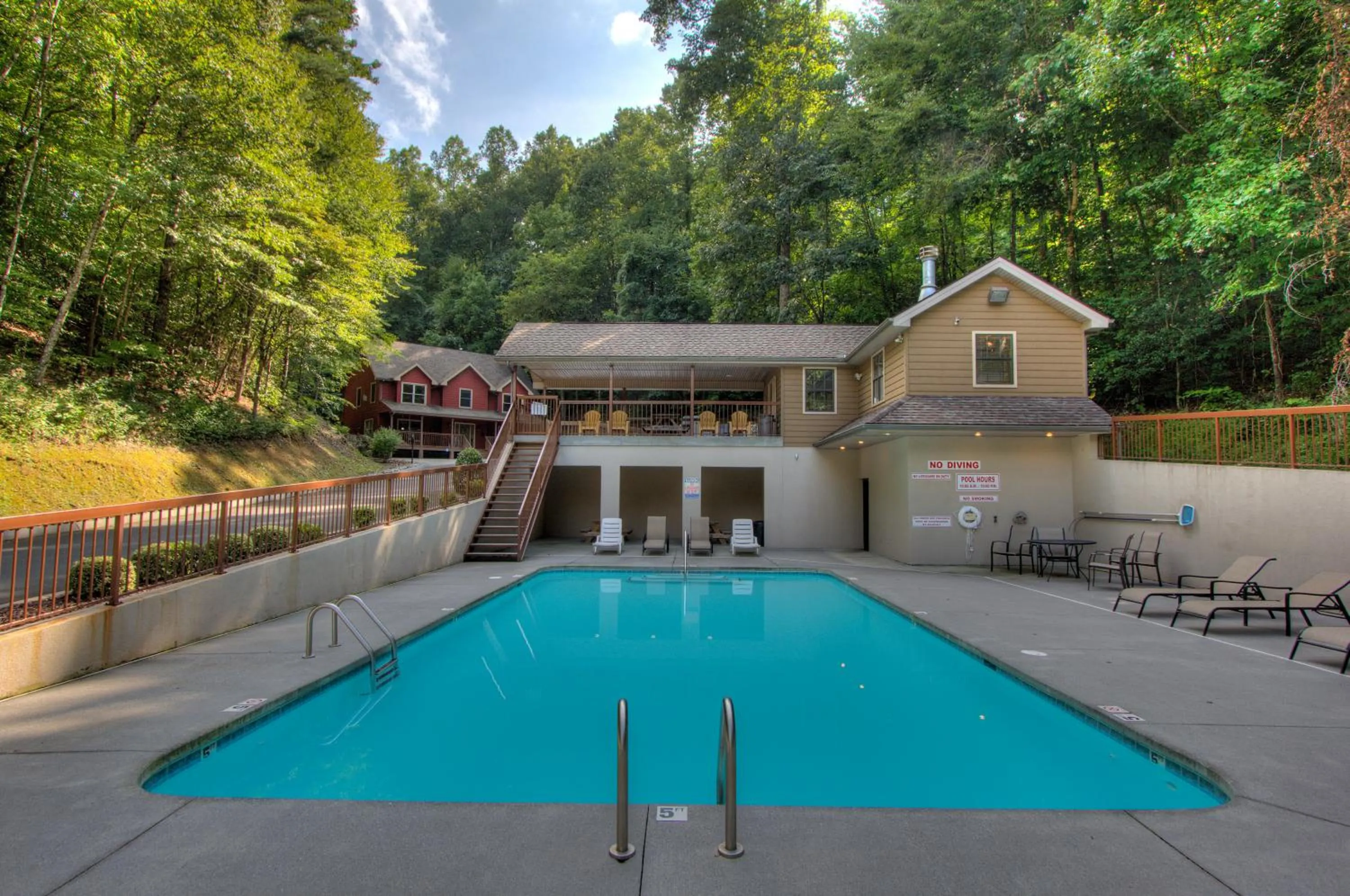 Swimming pool in Gorgeous "Country Roads" by HoneyBearCabins 4BR 4BA, next to pool, easy drive, main strip location!
