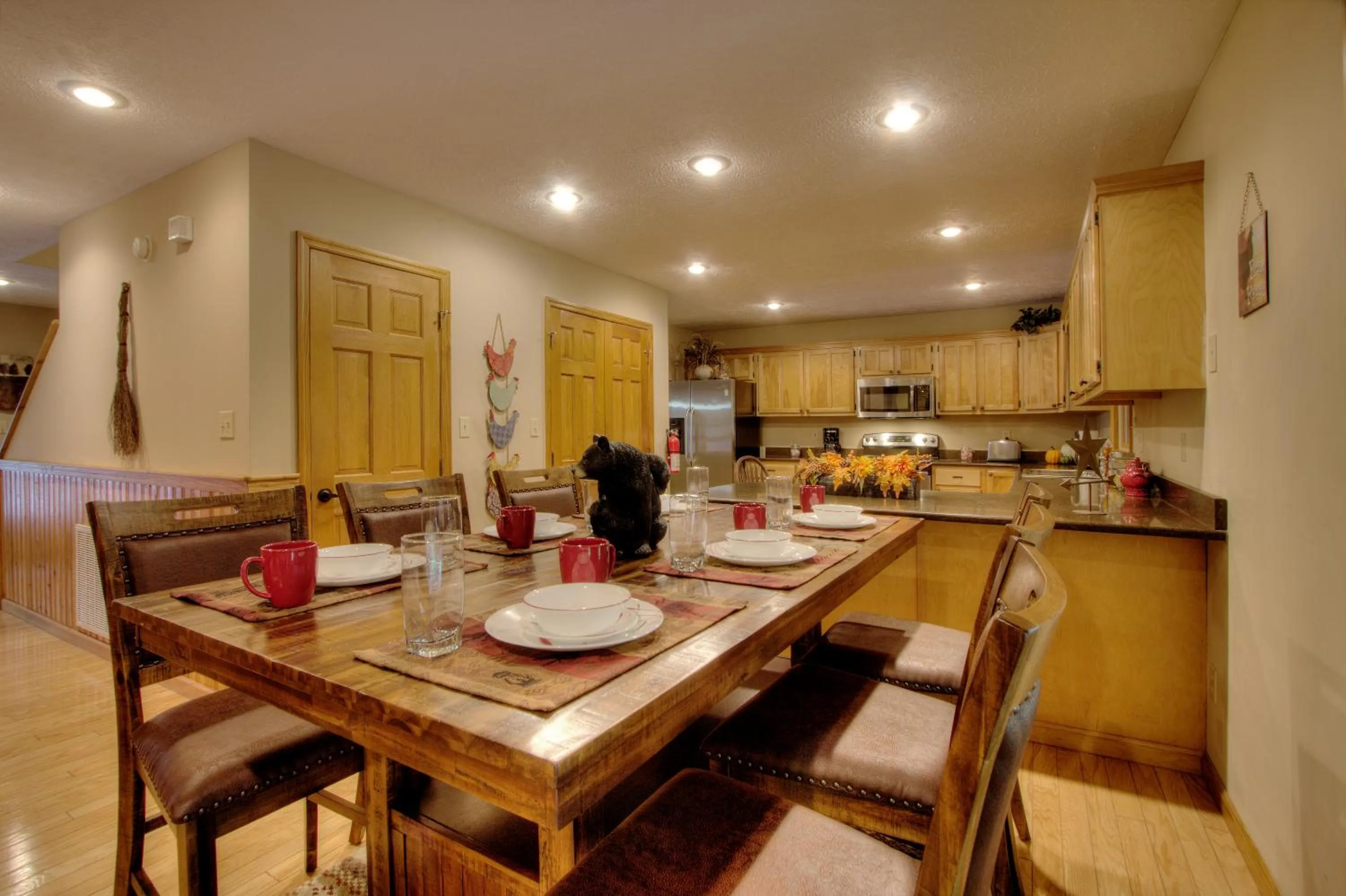 Dining area in Gorgeous "Country Roads" by HoneyBearCabins 4BR 4BA, next to pool, easy drive, main strip location!