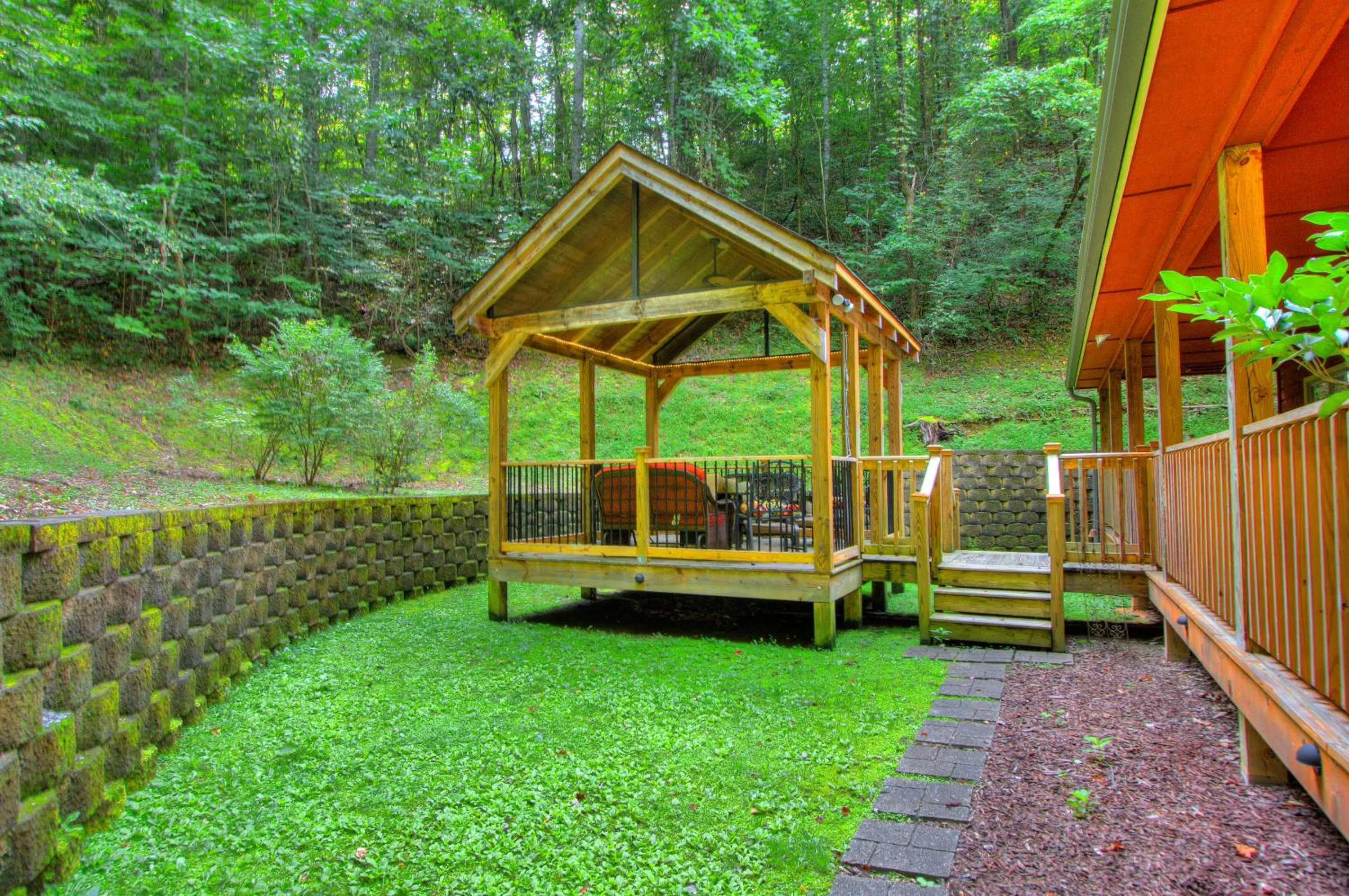 Patio in Gorgeous "Country Roads" by HoneyBearCabins 4BR 4BA, next to pool, easy drive, main strip location!