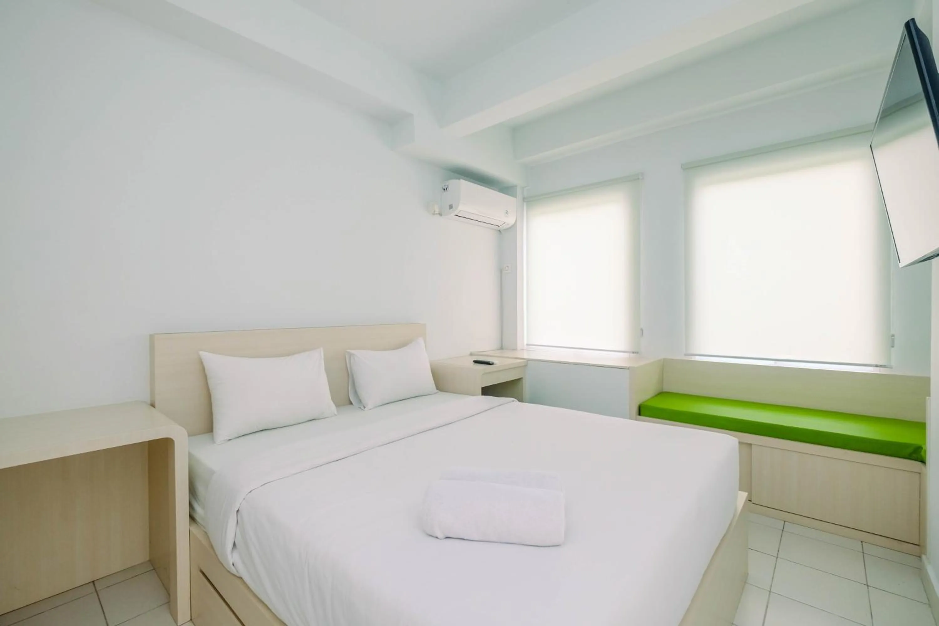Comfy and Minimalist 1BR Patraland Urbano Apartment near Bekasi Station By Travelio