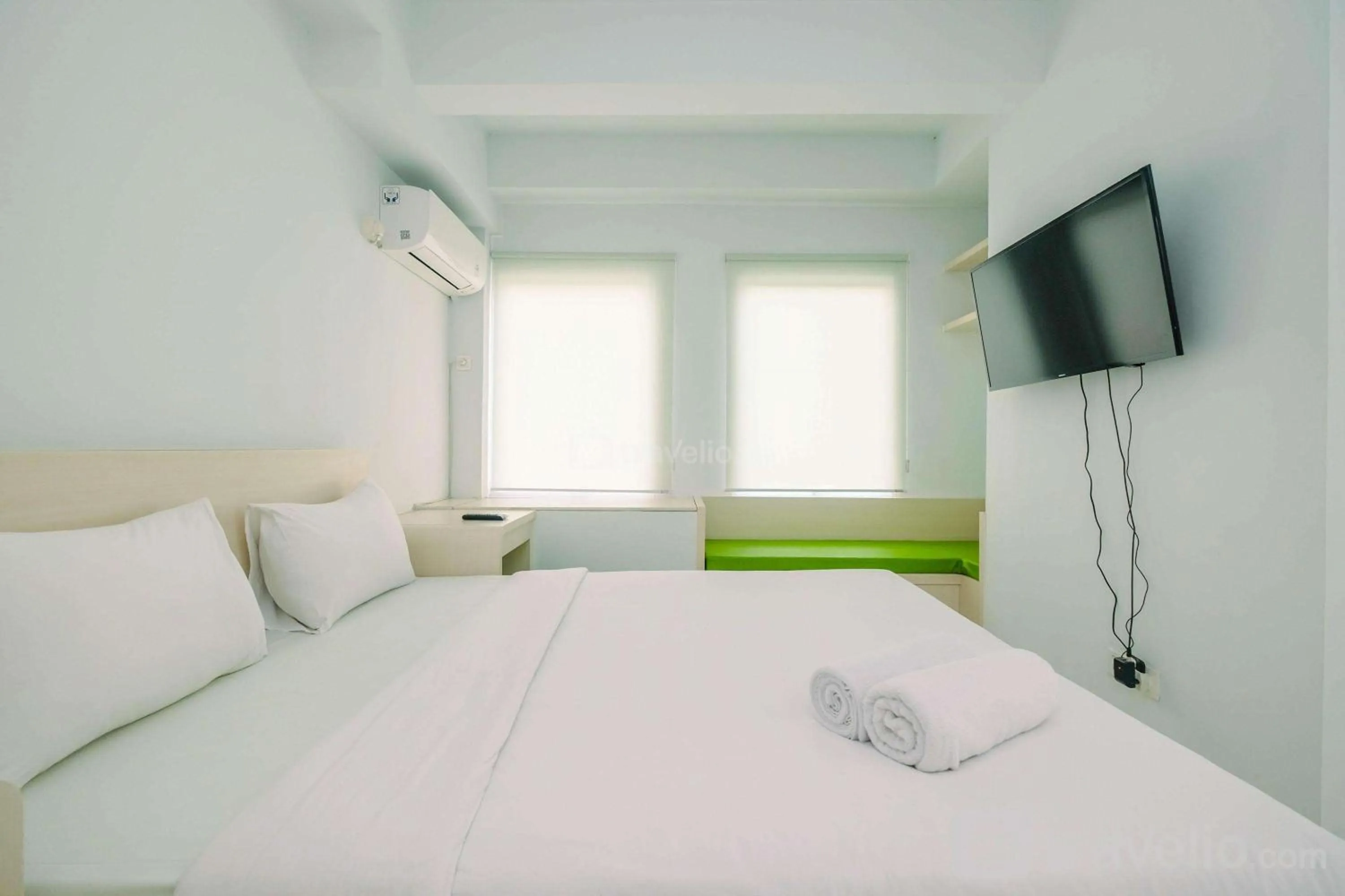 Bed in Comfy and Minimalist 1BR Patraland Urbano Apartment near Bekasi Station By Travelio