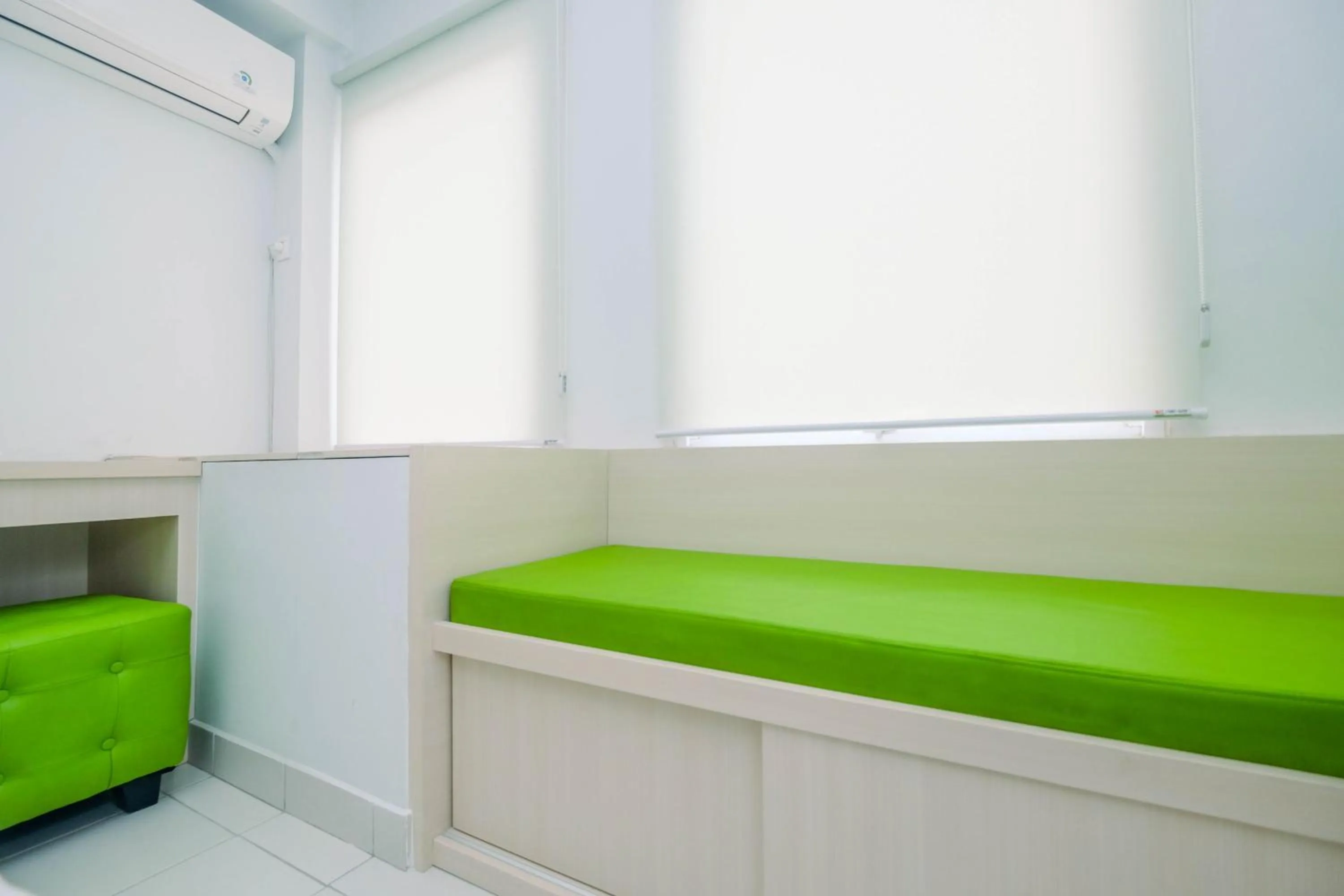 Comfy and Minimalist 1BR Patraland Urbano Apartment near Bekasi Station By Travelio