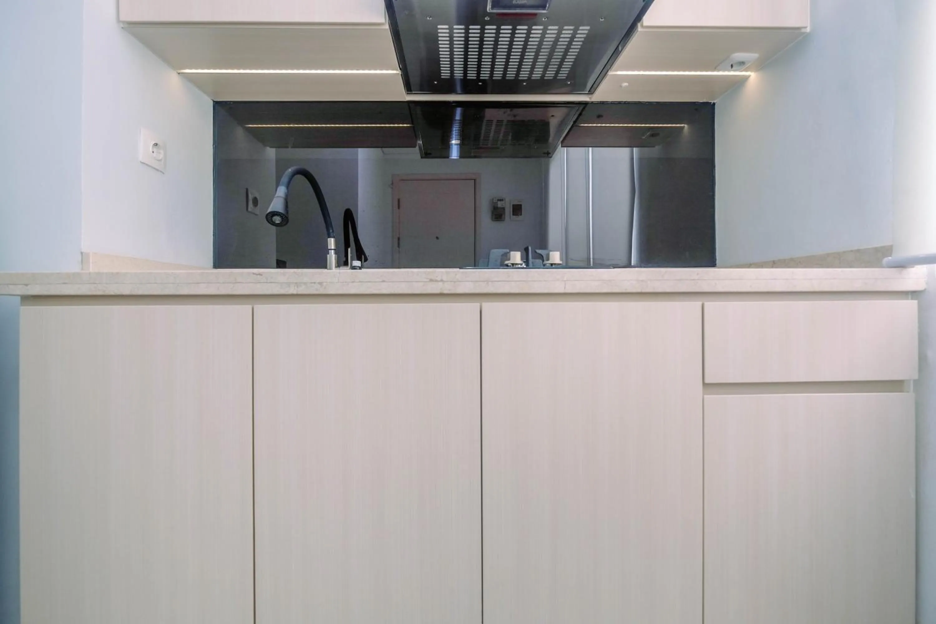 Comfy and Minimalist 1BR Patraland Urbano Apartment near Bekasi Station By Travelio