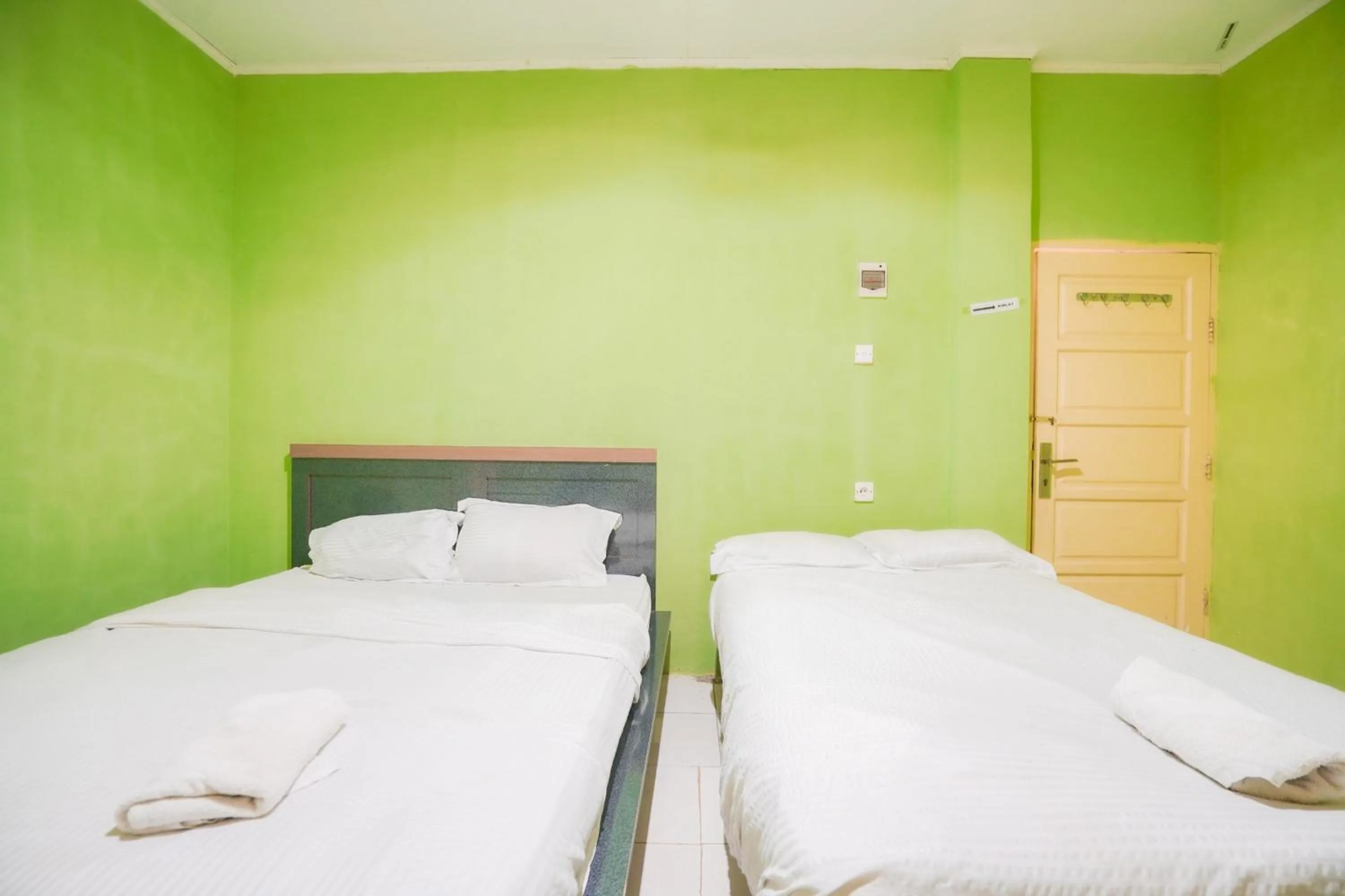 Bedroom, Bed in Urbanview Hotel Mine Residence Syariah