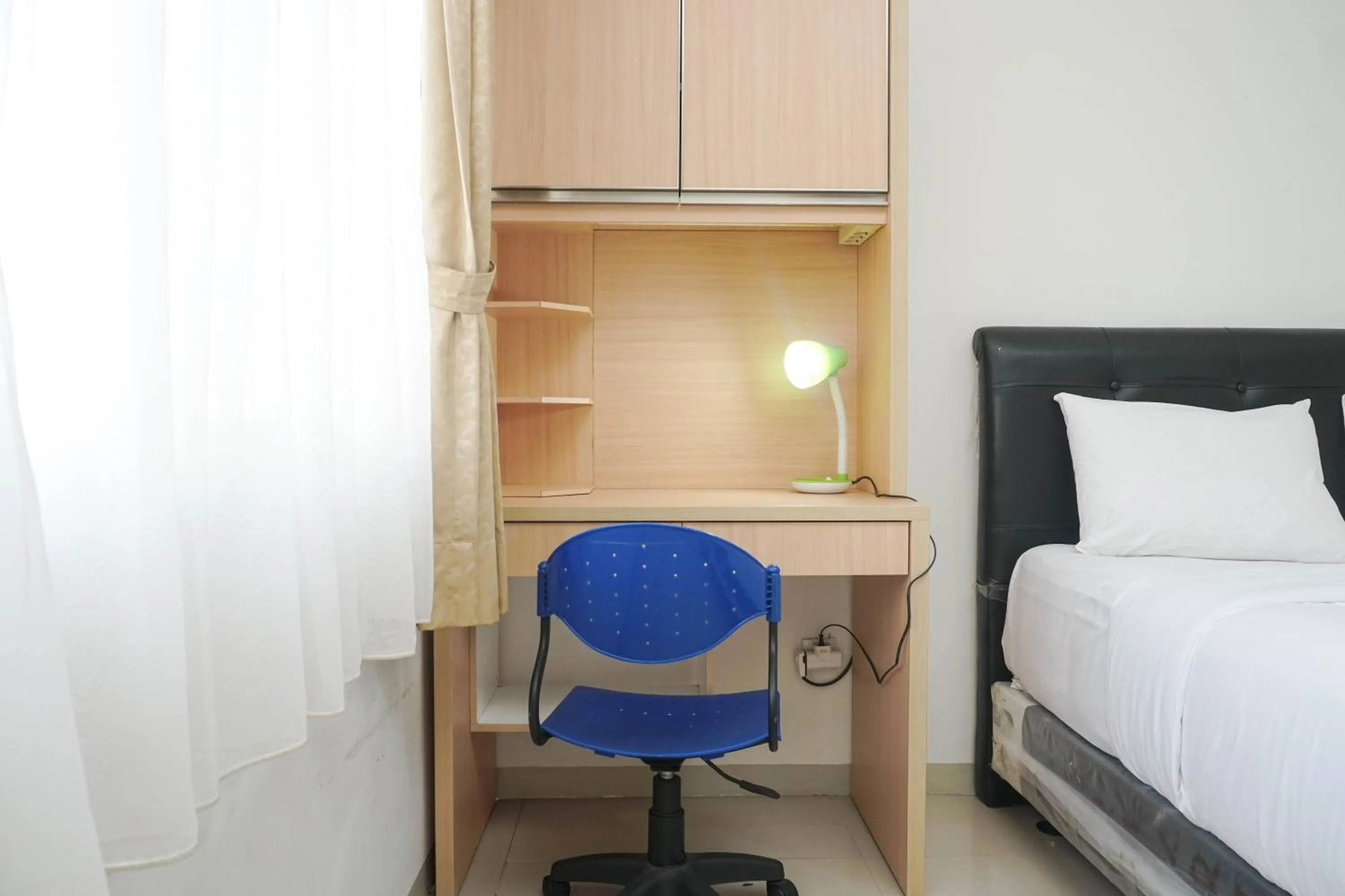 Bed in Minimalist Studio Park View Condominium Apartment near Mall By Travelio