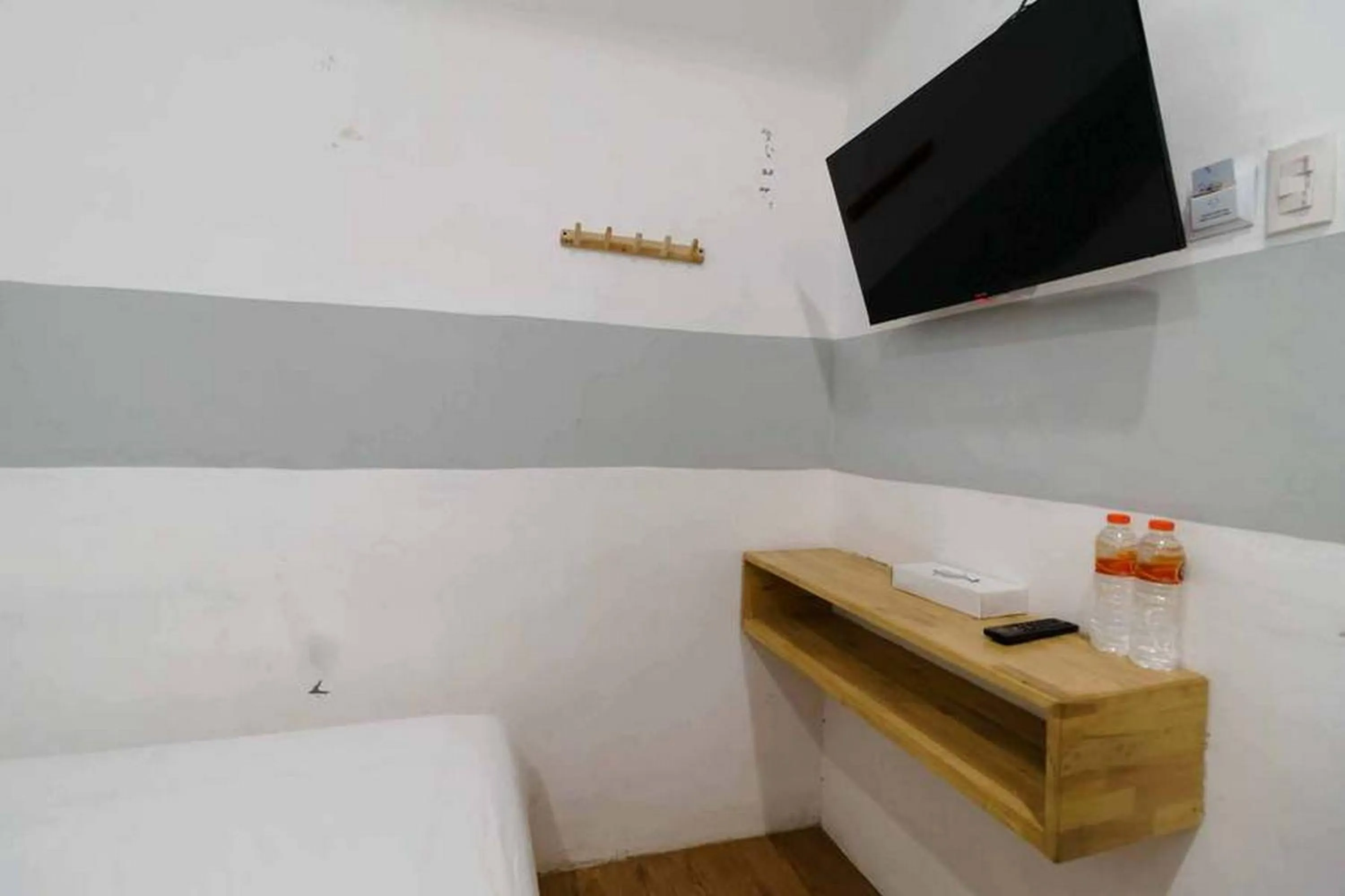 Bed in RedDoorz at Jotel Guest House Medan