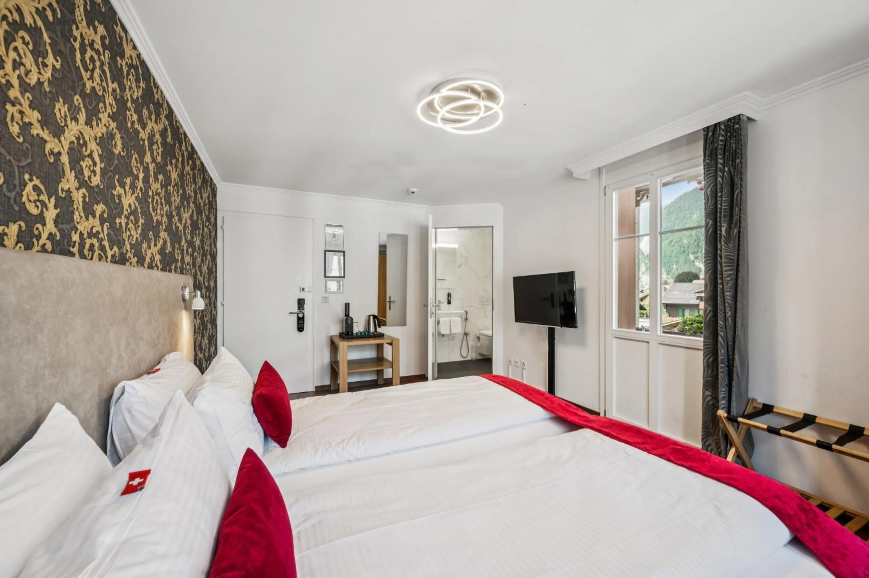 Bedroom, Bed in Hotel Sonne Interlaken-Matten