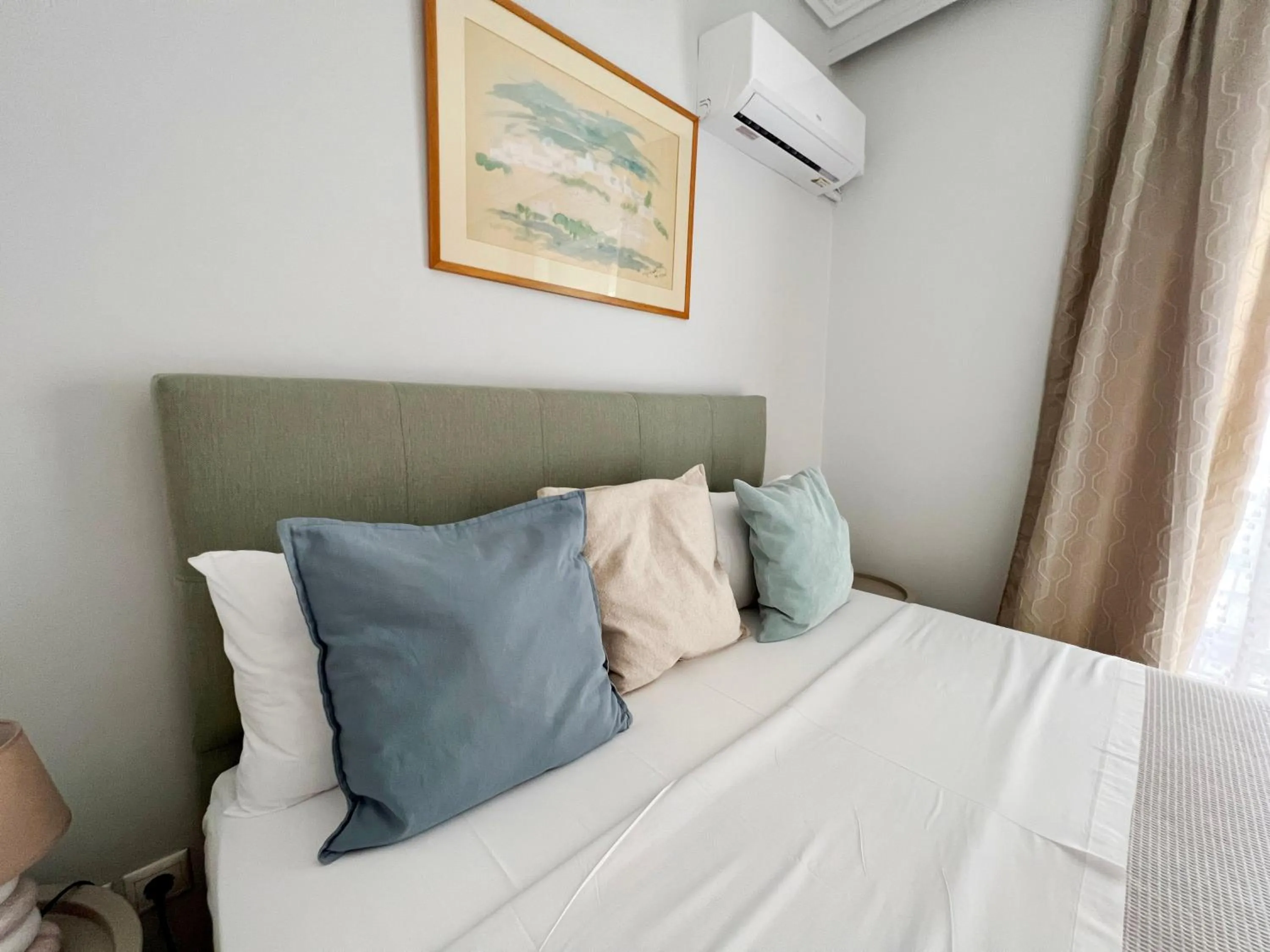 Bed in Peaceful Apartment by Flisvos Marina by Athenian Homes