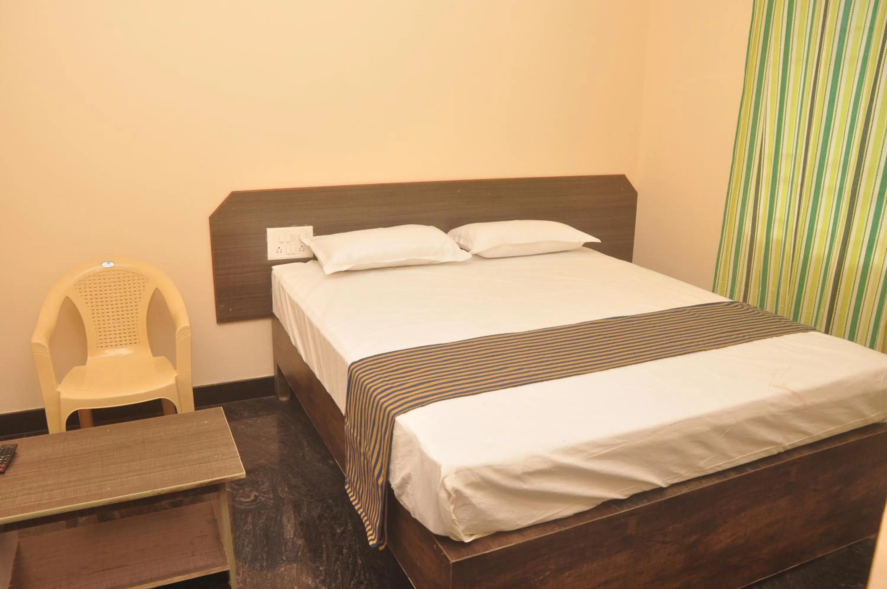 Bed in Hotel Aishwariyam