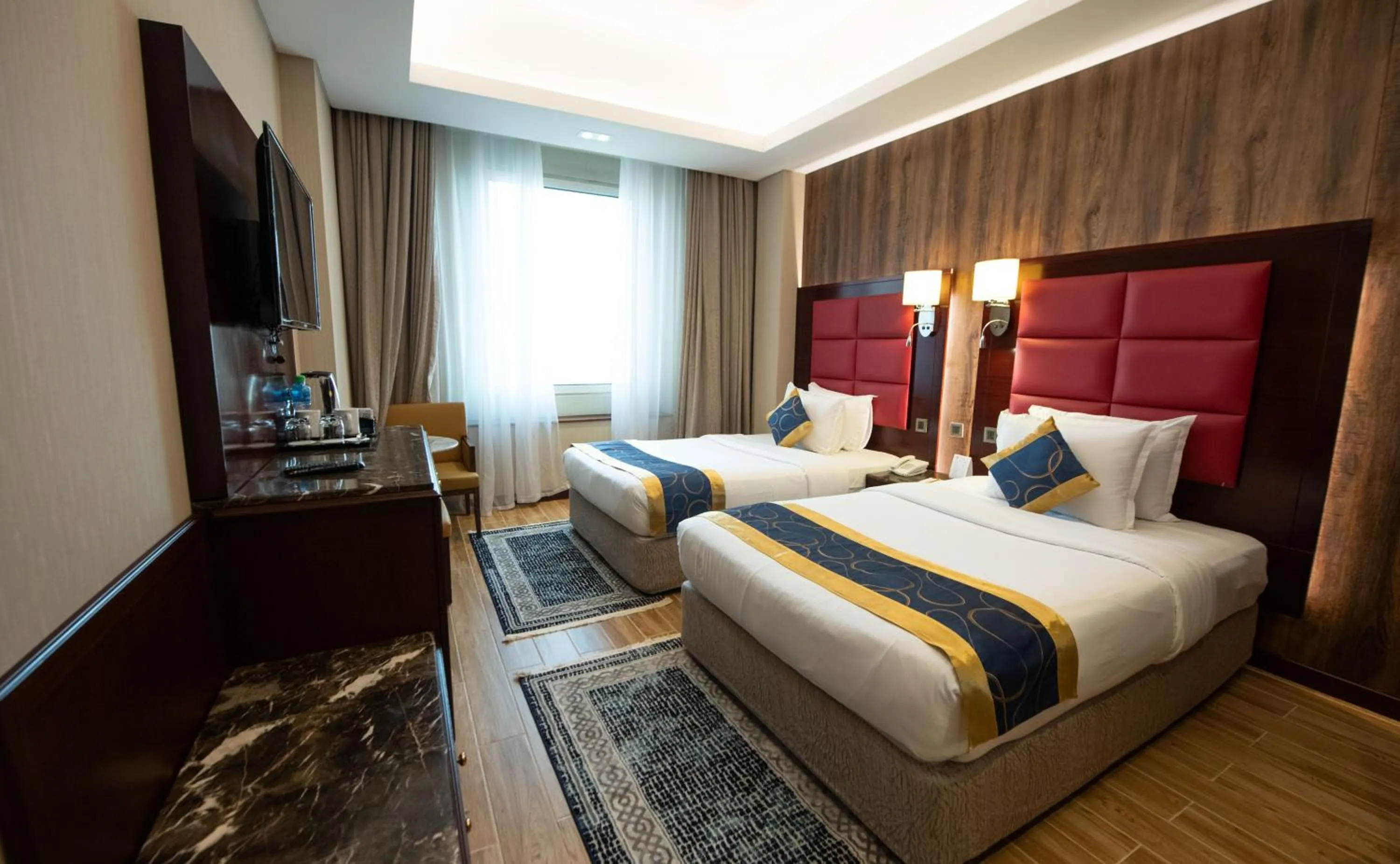 Bed in Ramee Guestline Hotel