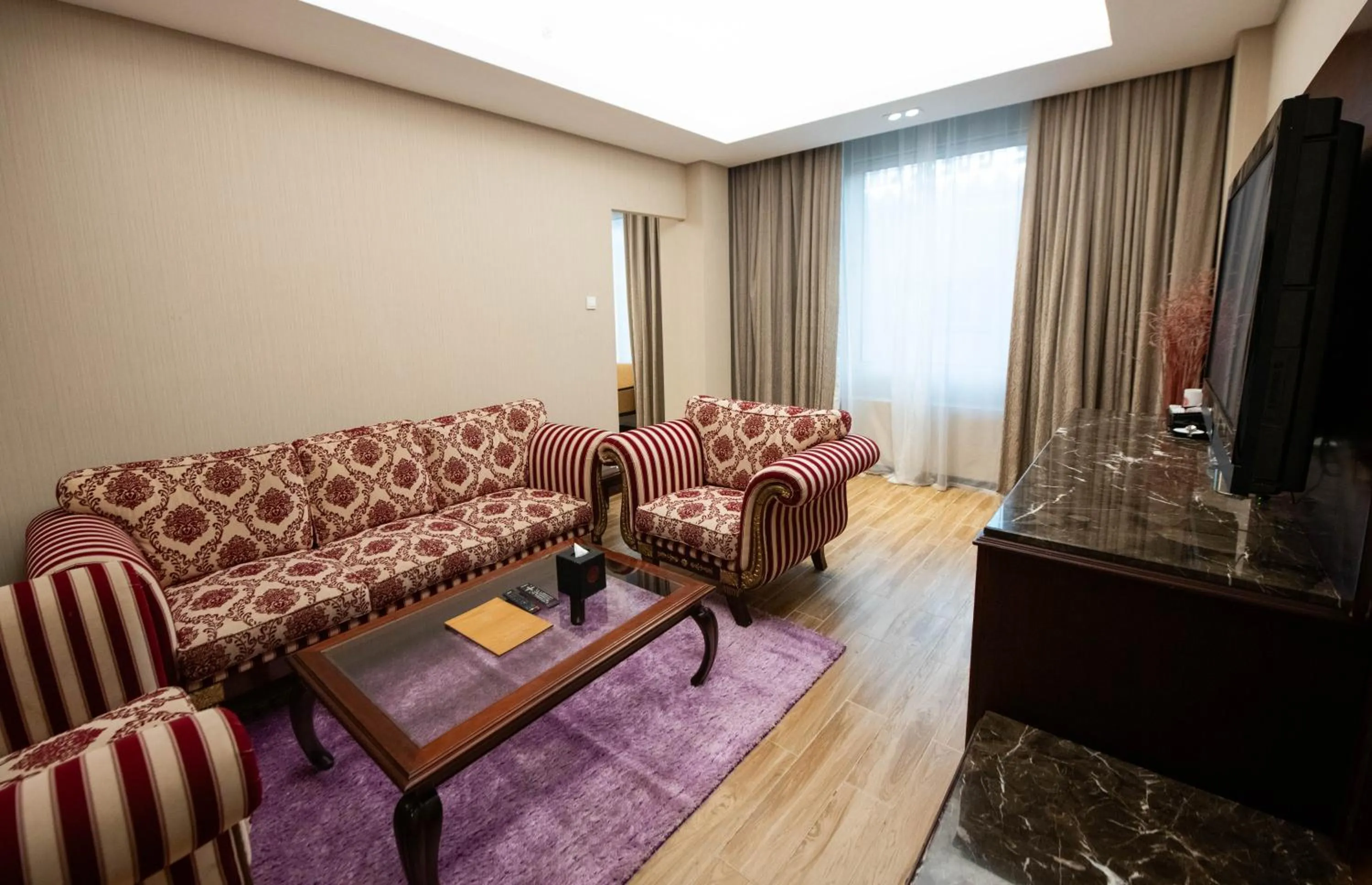 Seating area in Ramee Guestline Hotel