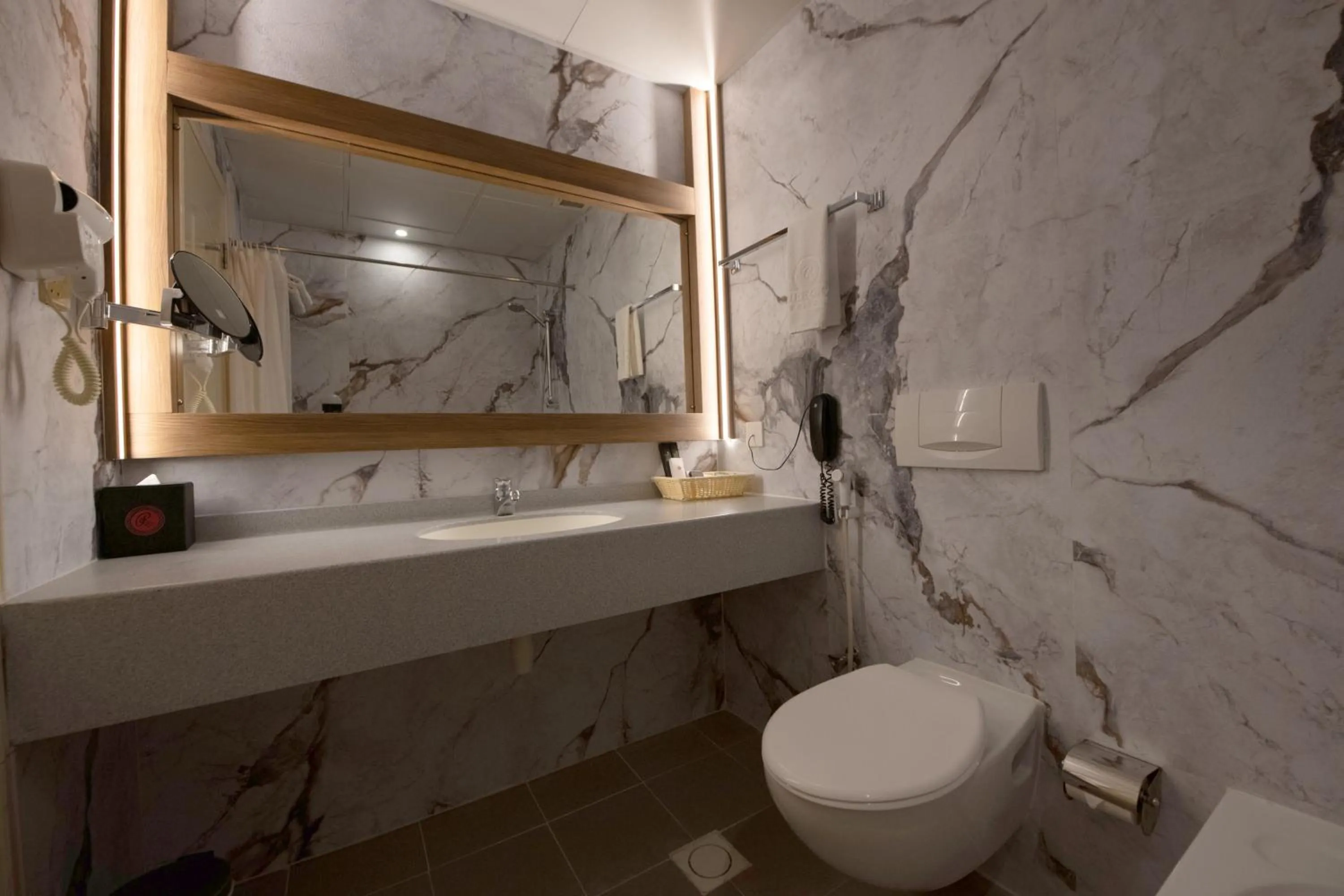 Bathroom in Ramee Guestline Hotel