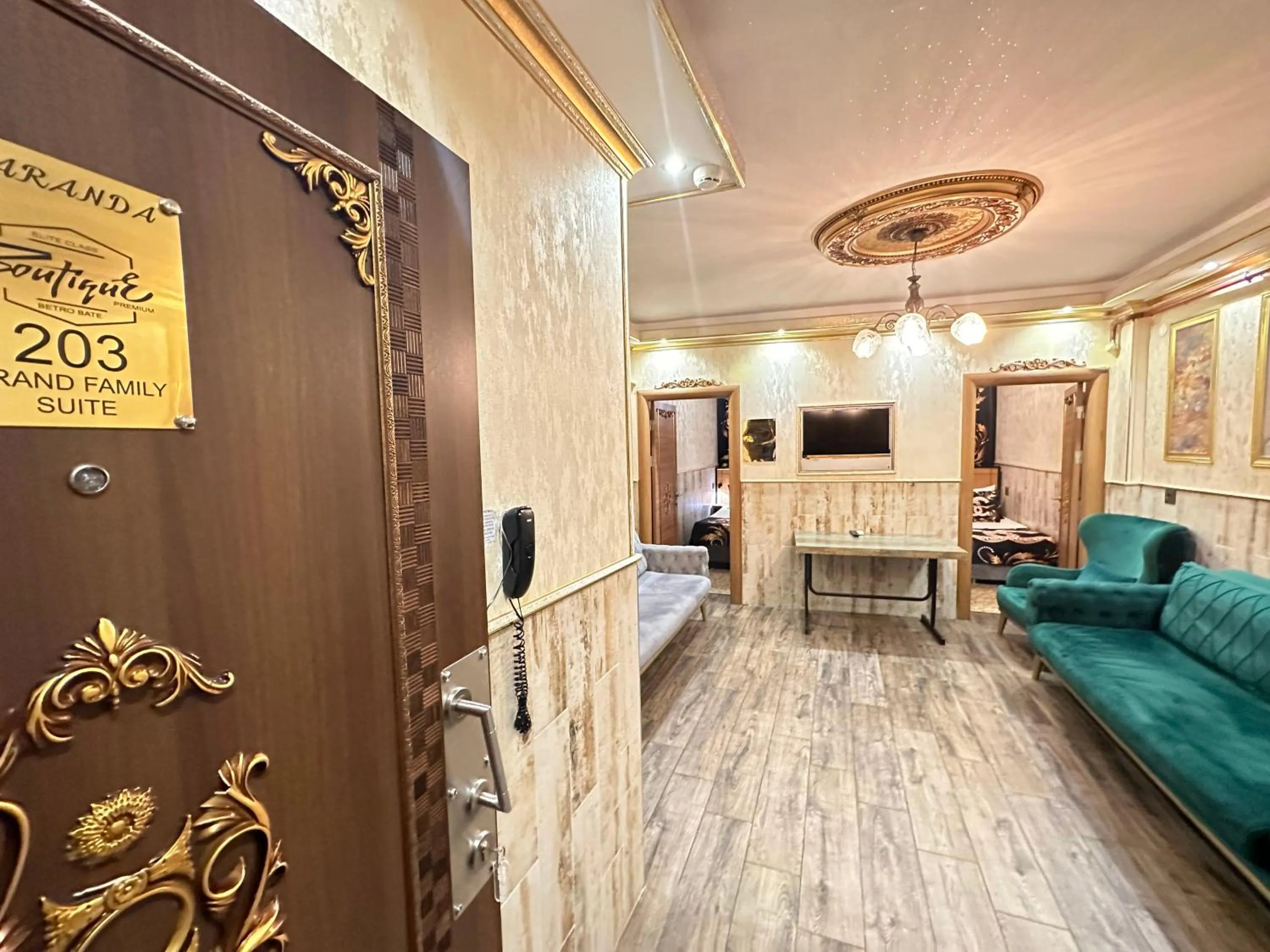 Communal lounge/ TV room in Maranda Suit Hotel