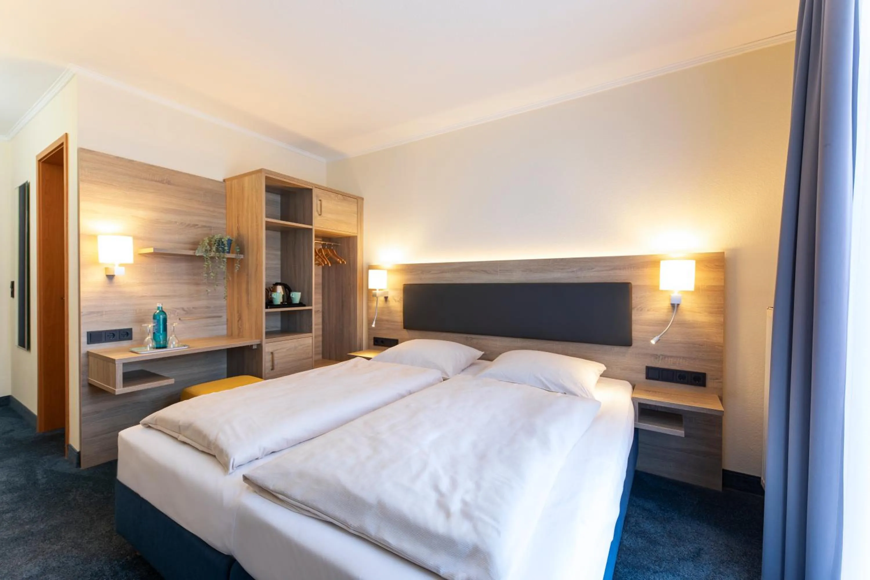 Photo of the whole room, Bed in Roomingtons Hotel Lohr am Main