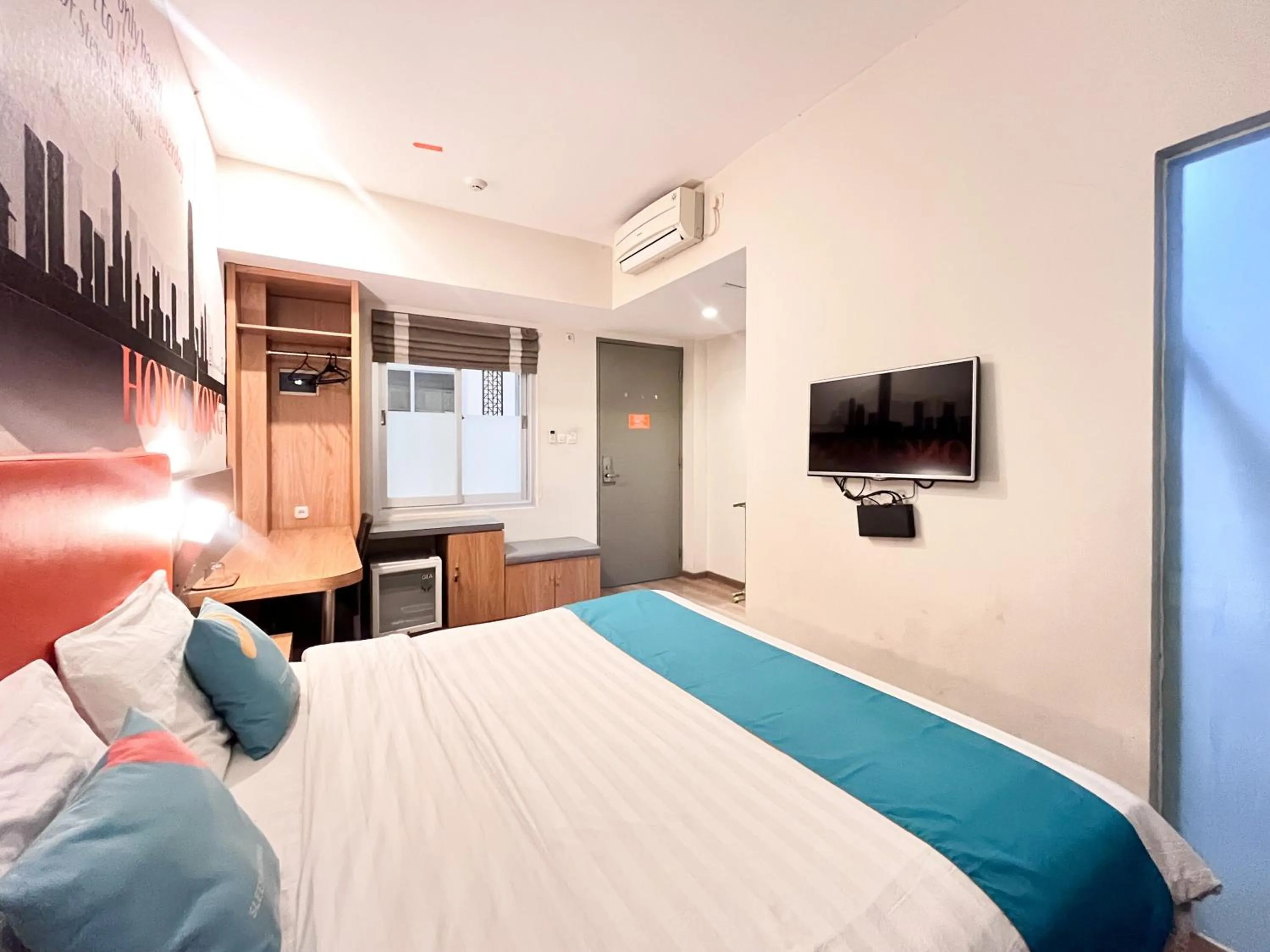 Bedroom, Bed in Sans Hotel Syariah Graha 100 Gubeng Surabaya