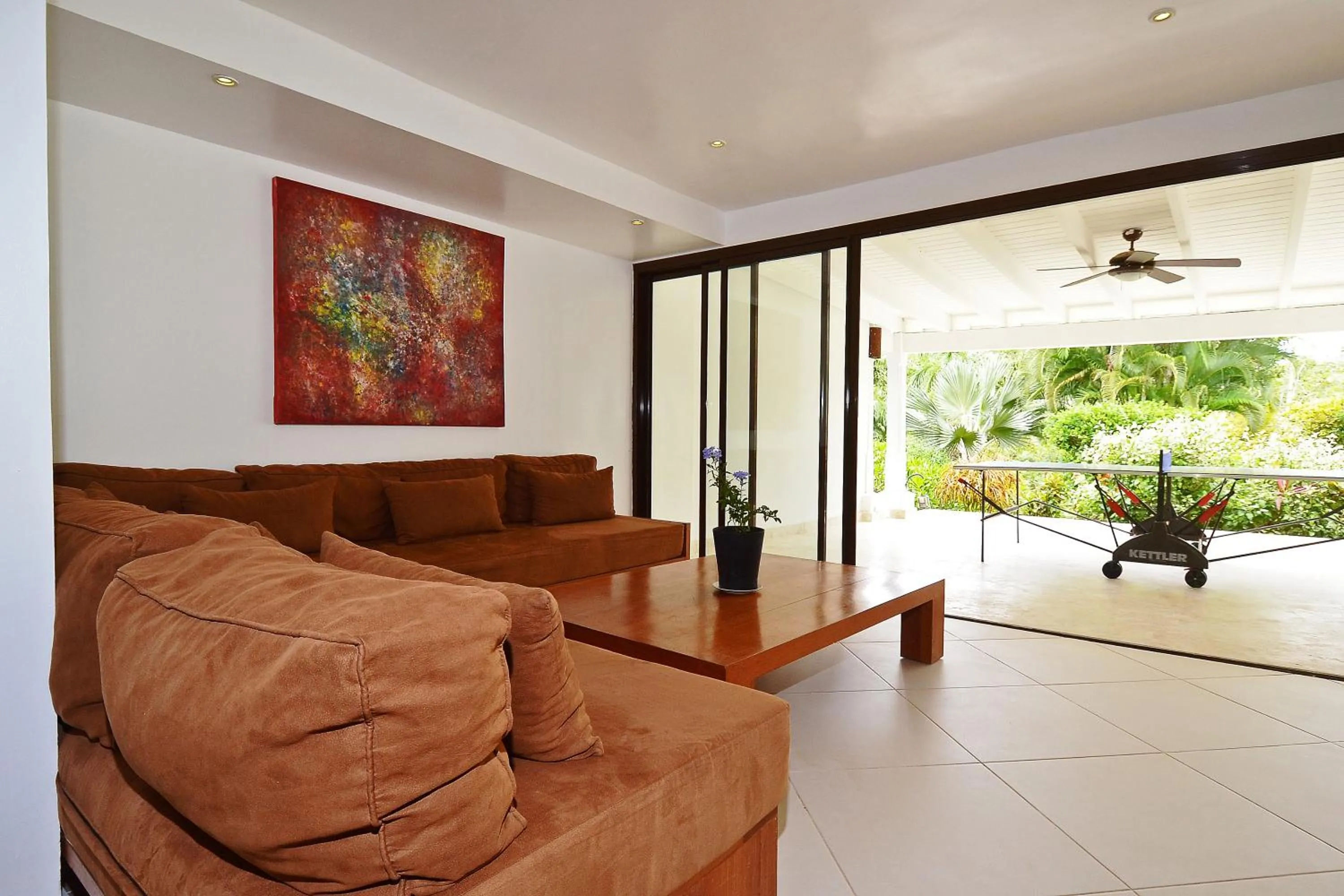 Seating area in Las Terrenas Front Beach And Garden Villa with private staff