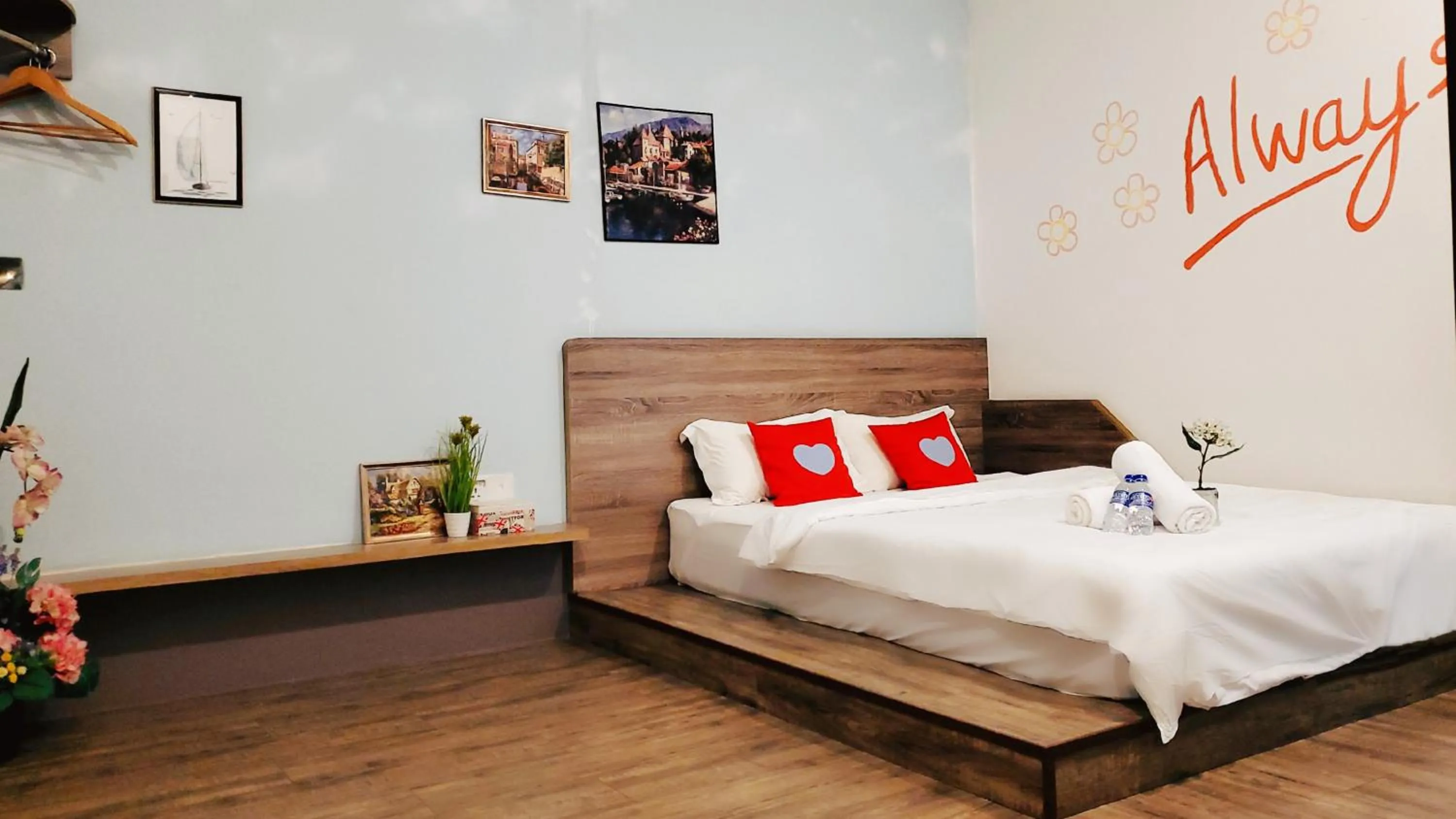 Bed in Winggarden Murals House by JE Boutique Guesthouse