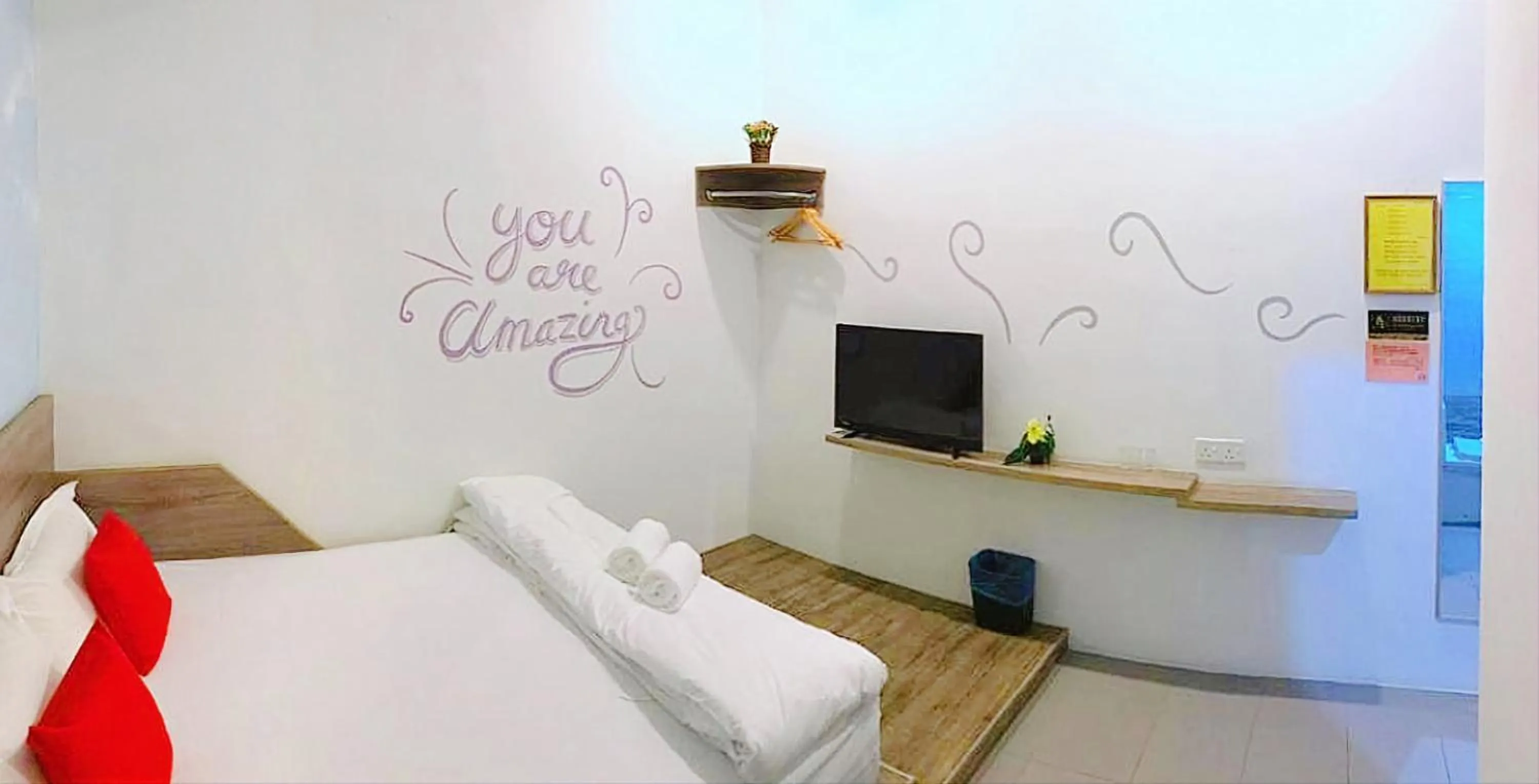 Bed in Winggarden Murals House by JE Boutique Guesthouse