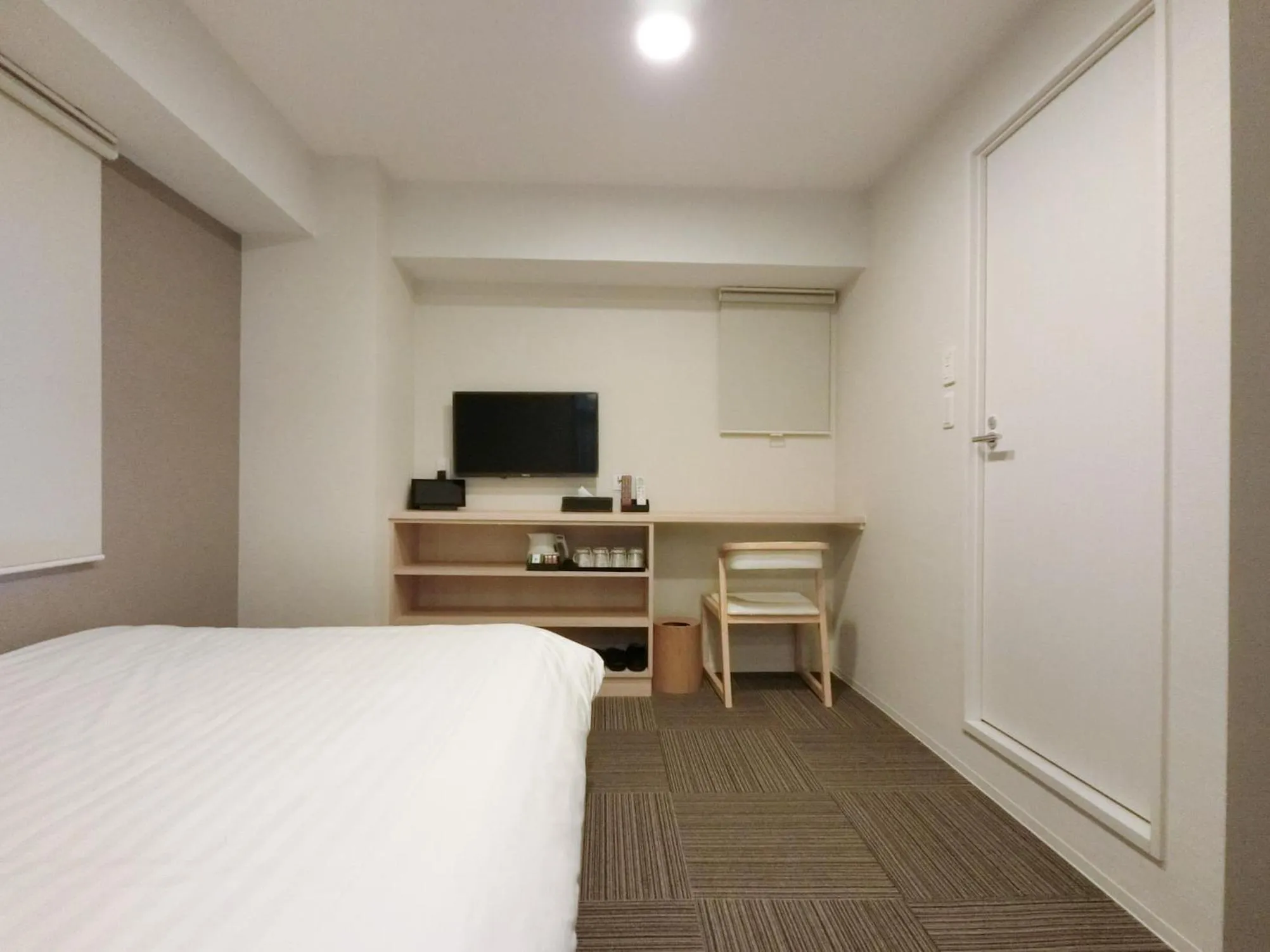 Bed in The Light Inn Tokyo