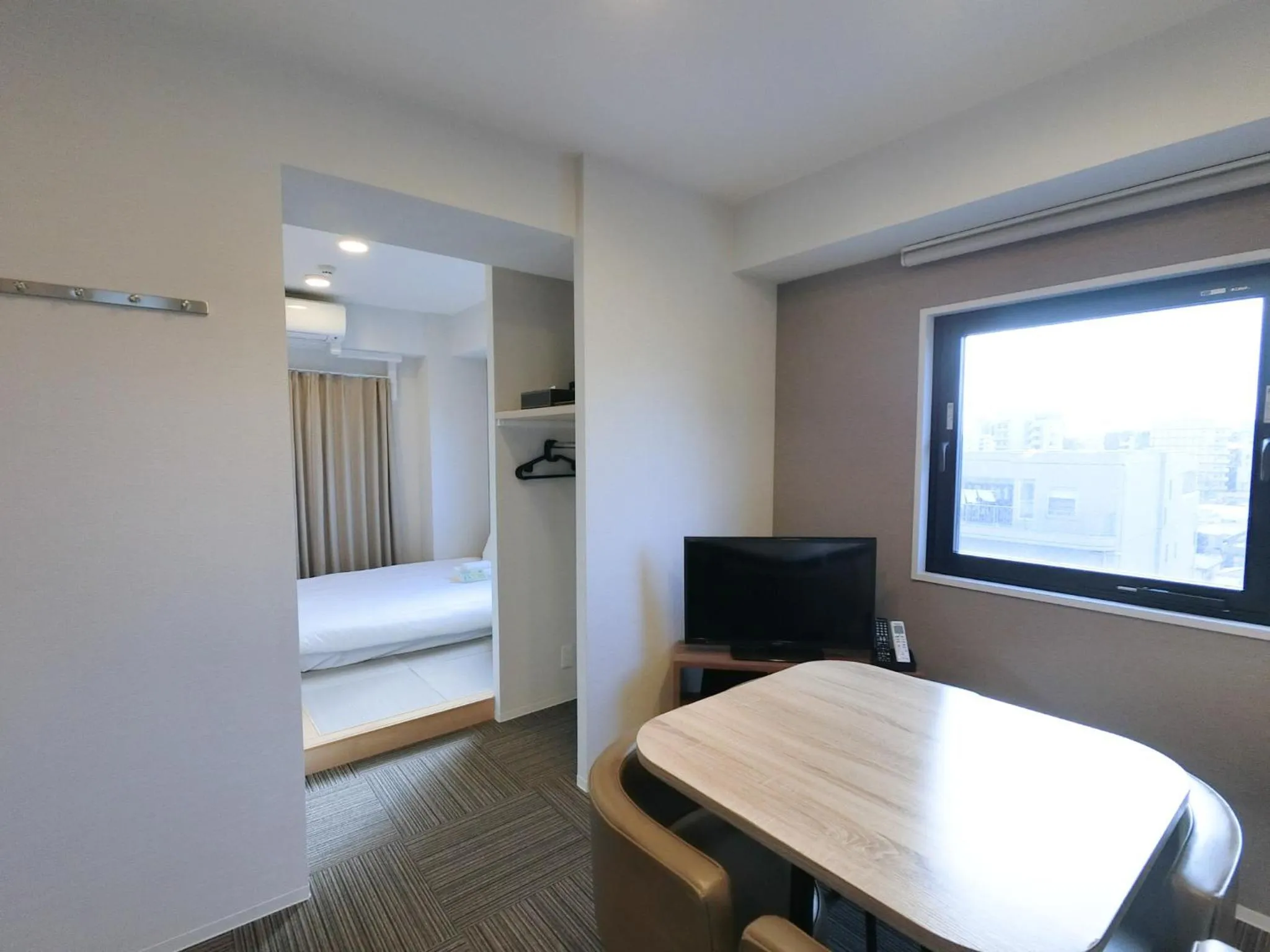 Bed in The Light Inn Tokyo