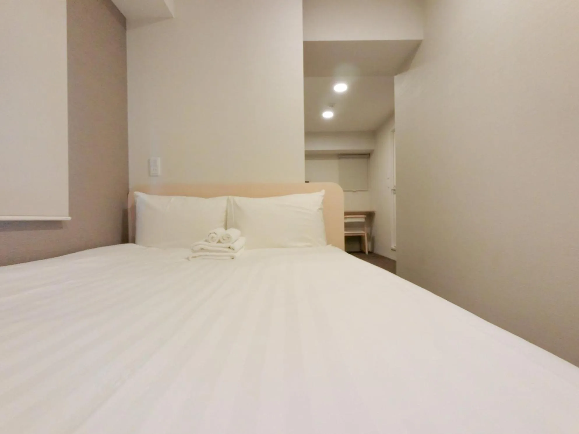 Bed in The Light Inn Tokyo