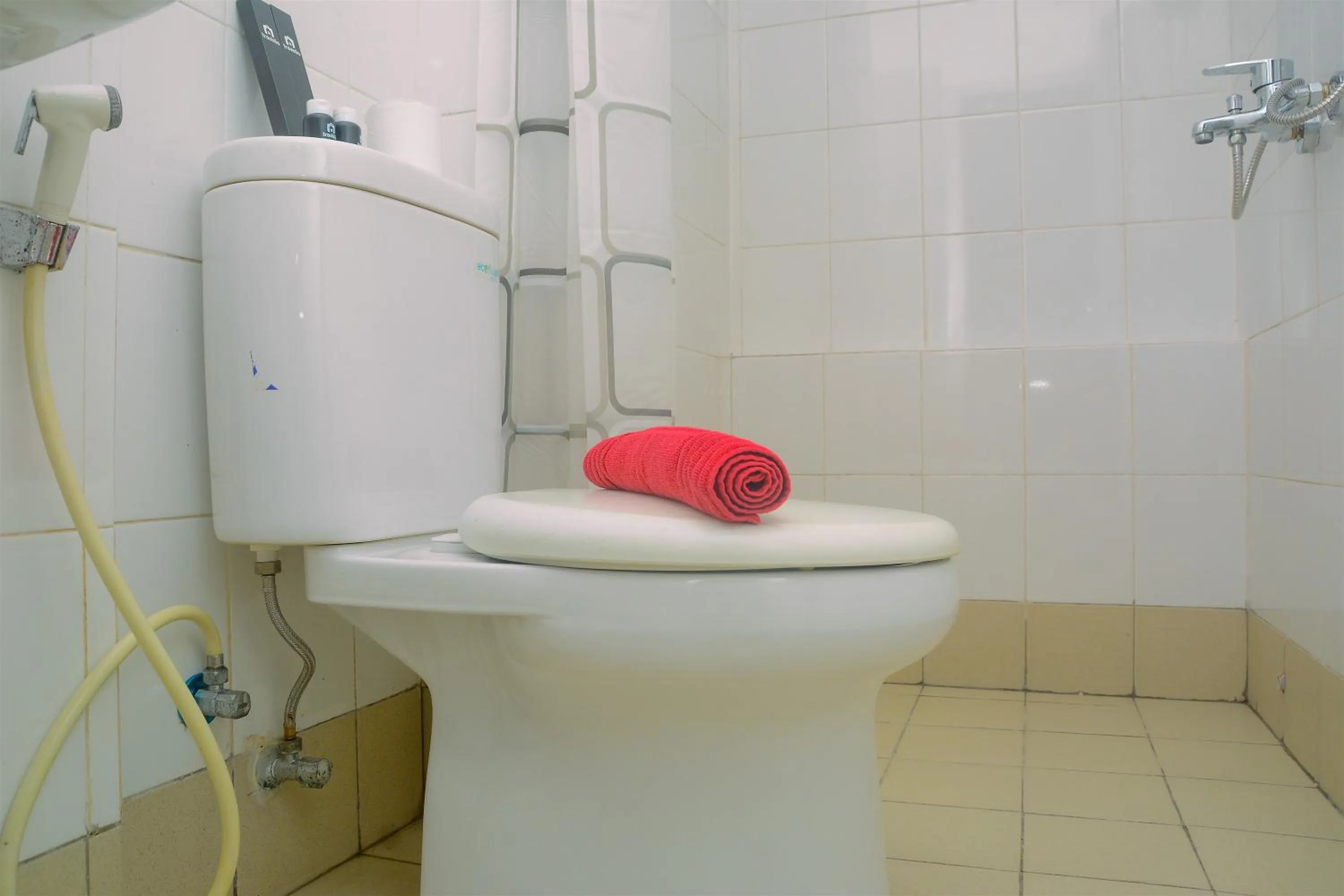 Bathroom in Best Deal 3BR Apartment Bassura City near Shopping Center By Travelio