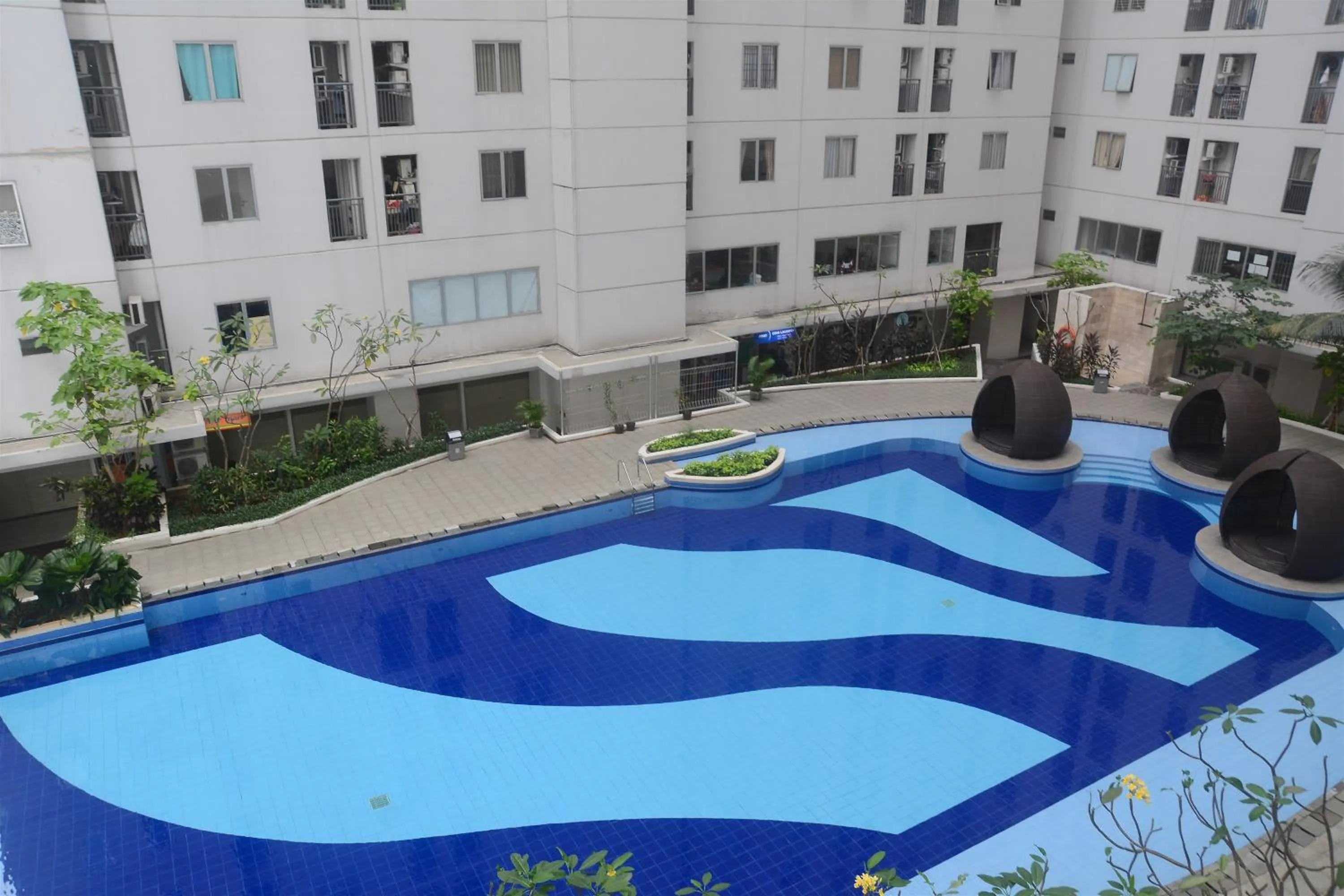 Property building in Best Deal 3BR Apartment Bassura City near Shopping Center By Travelio