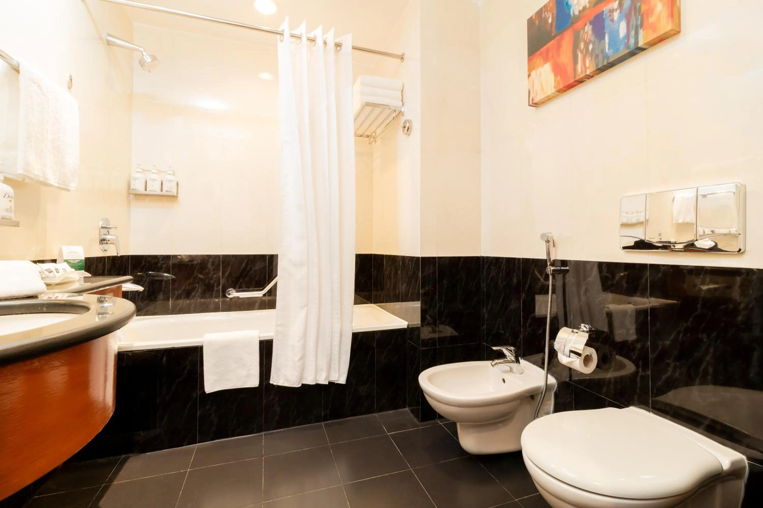 Bathroom in Holiday Inn - Suites Kuwait Salmiya by IHG