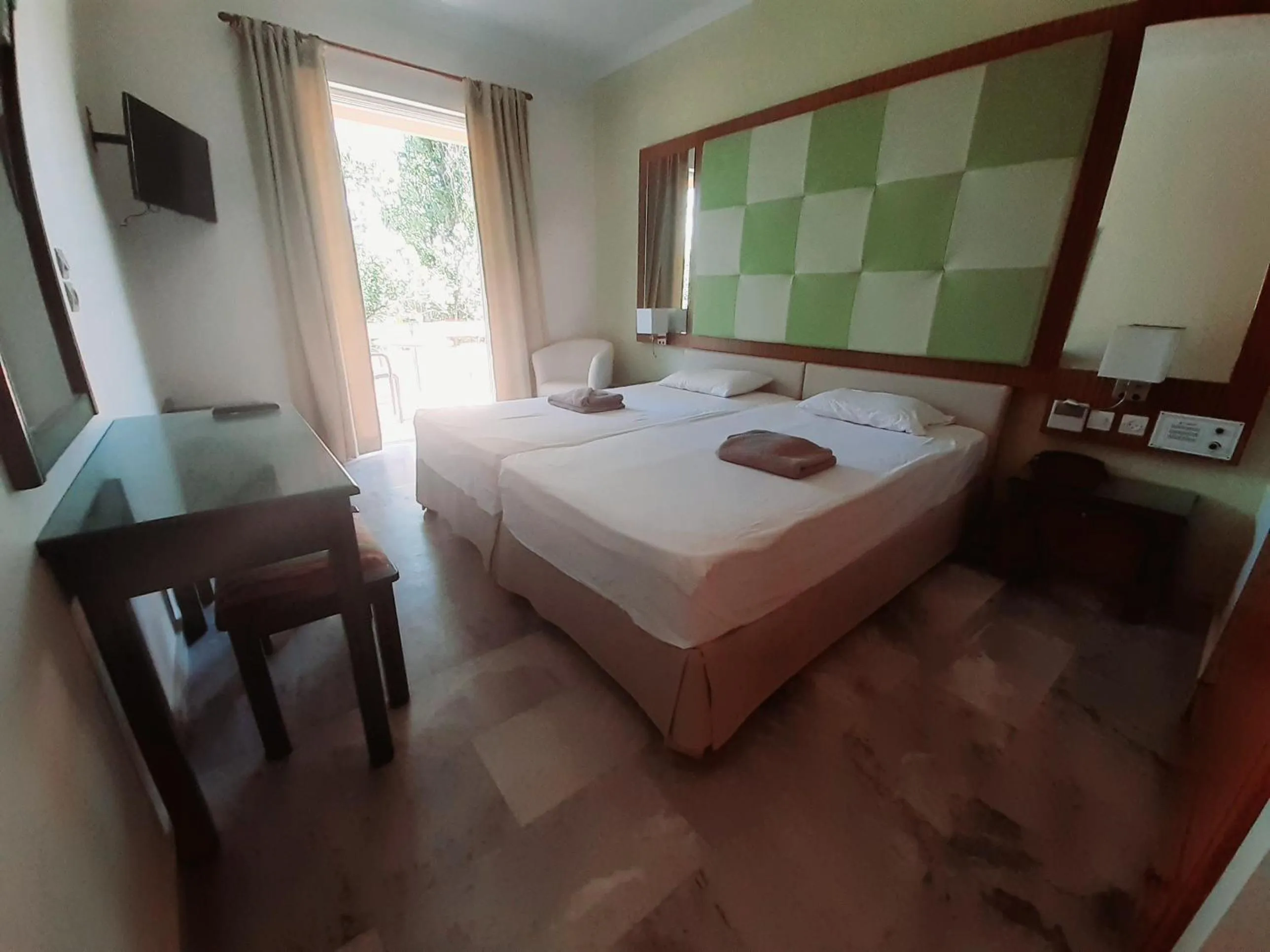 Bed in Kyriaki Hotel