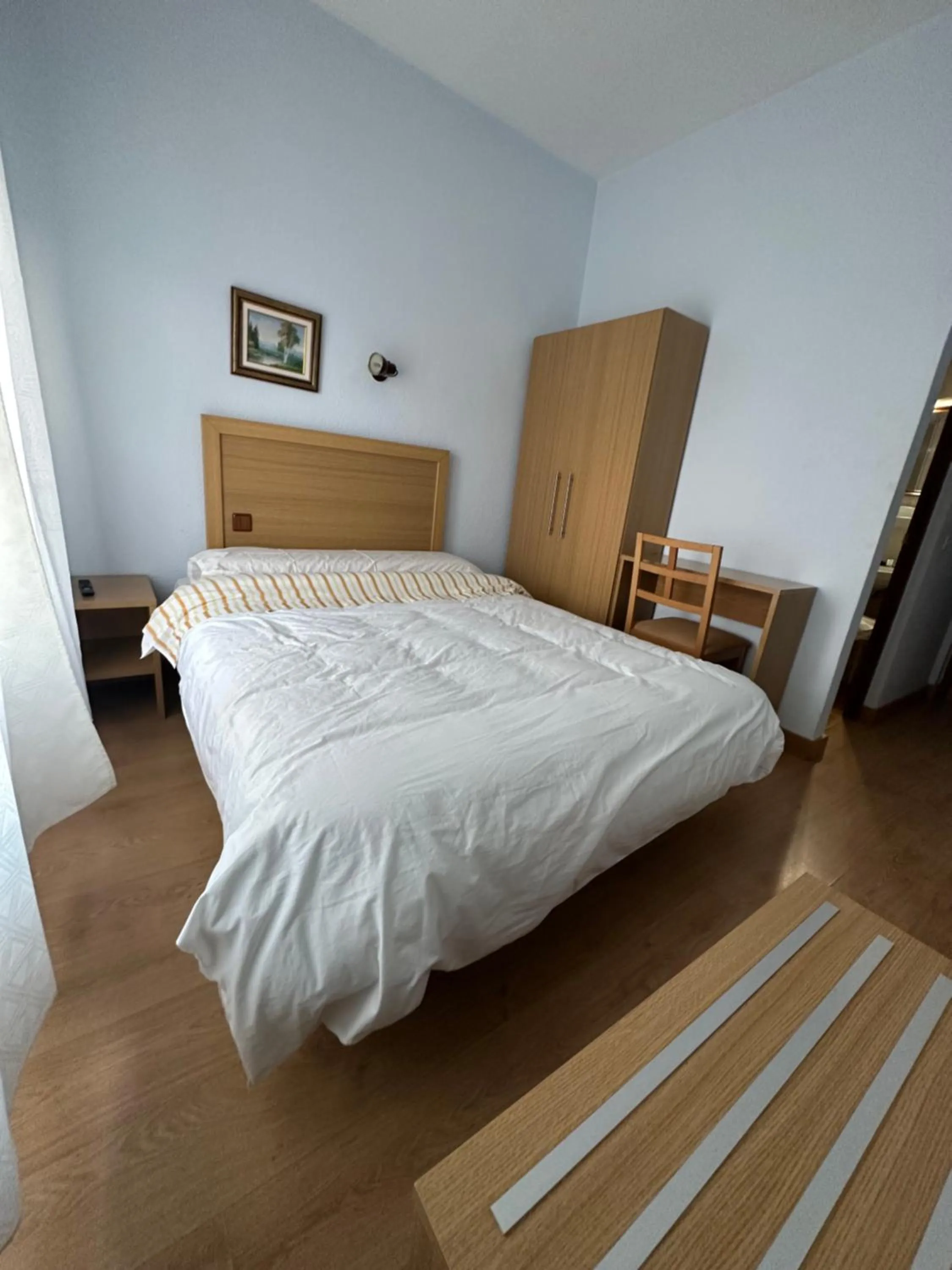 Bed in Hostal agripino y Restaurante asiático