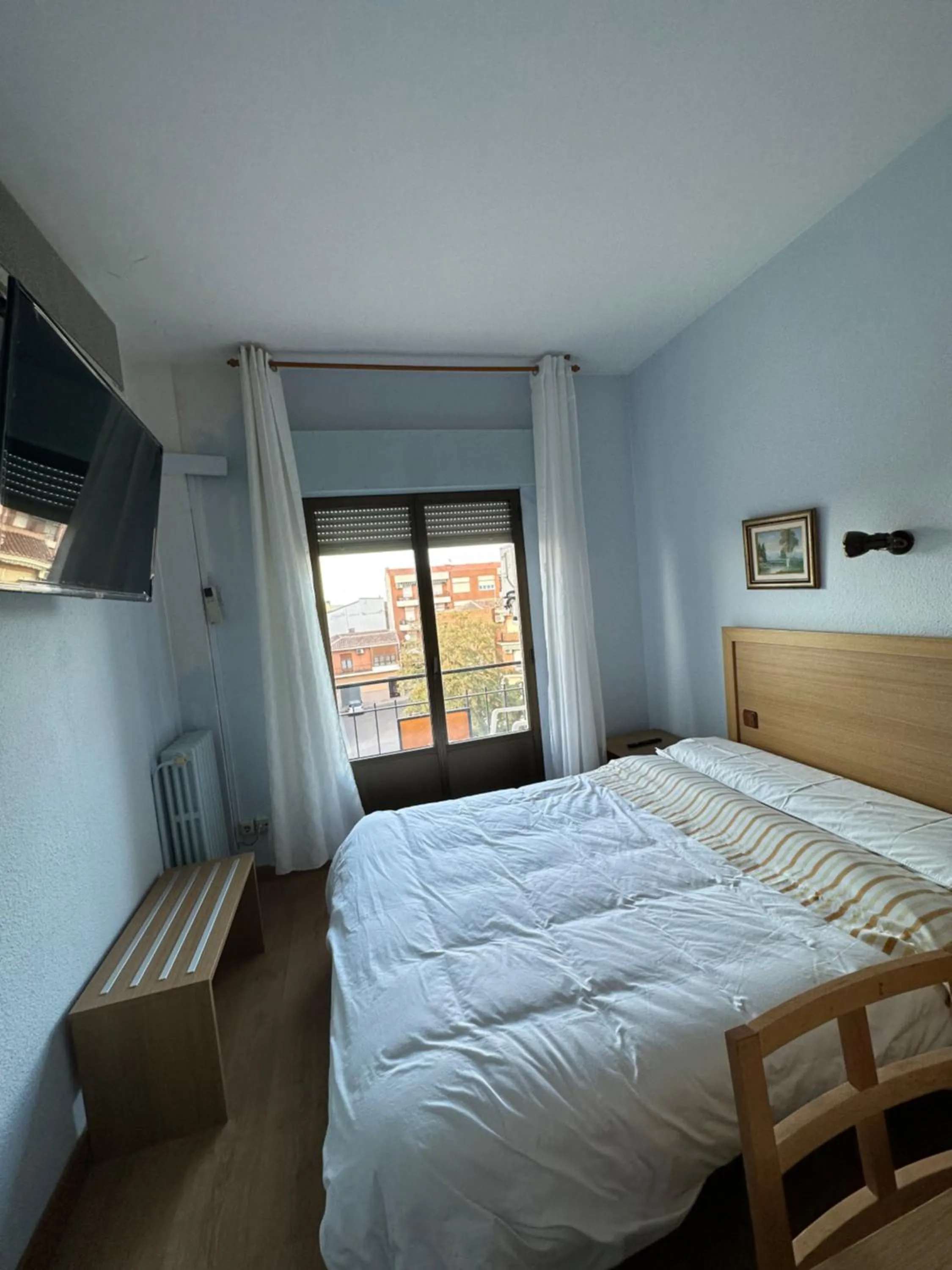 Bed in Hostal agripino y Restaurante asiático