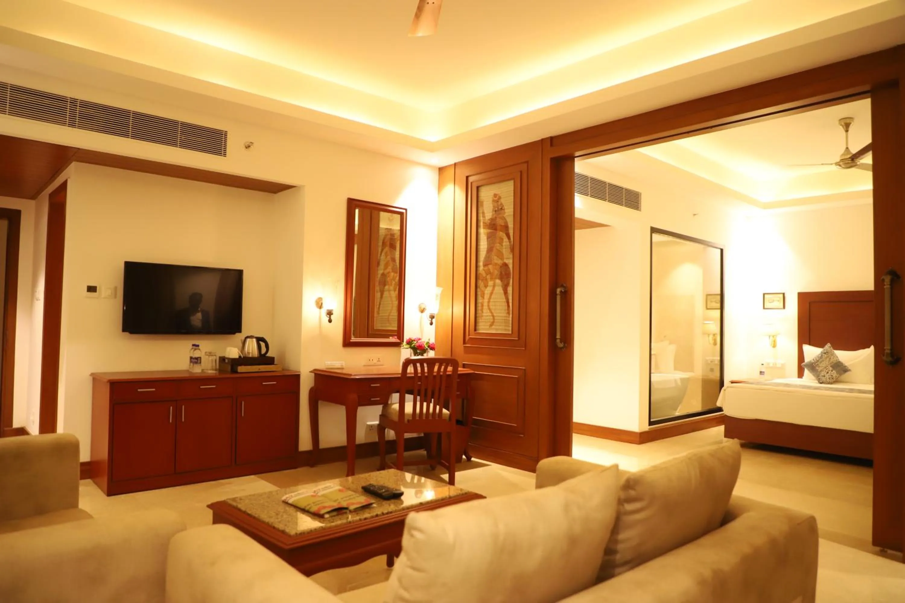 Communal lounge/ TV room, Bed in Hotel Chandela Khajuraho