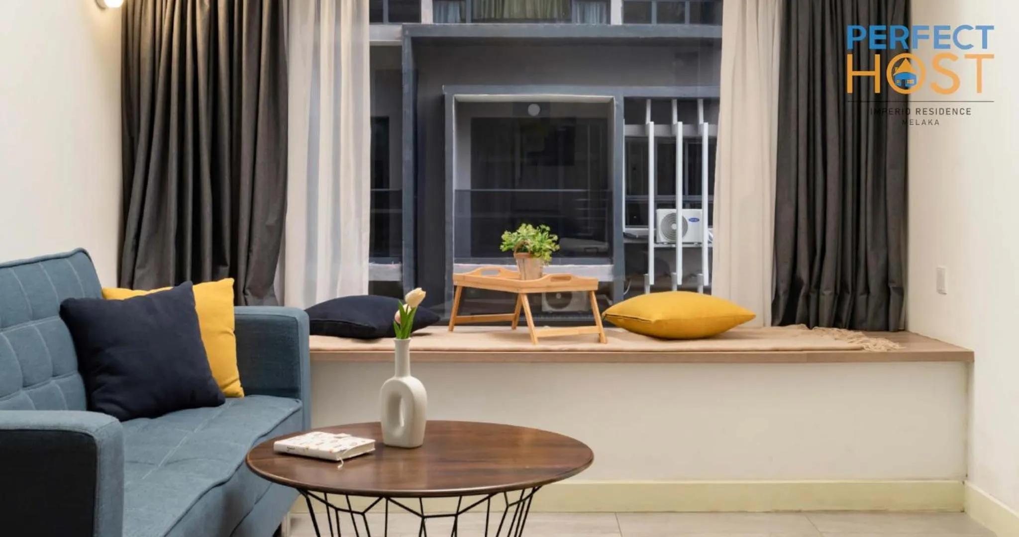 Living room in Imperio Residence Seafront by Perfect Host